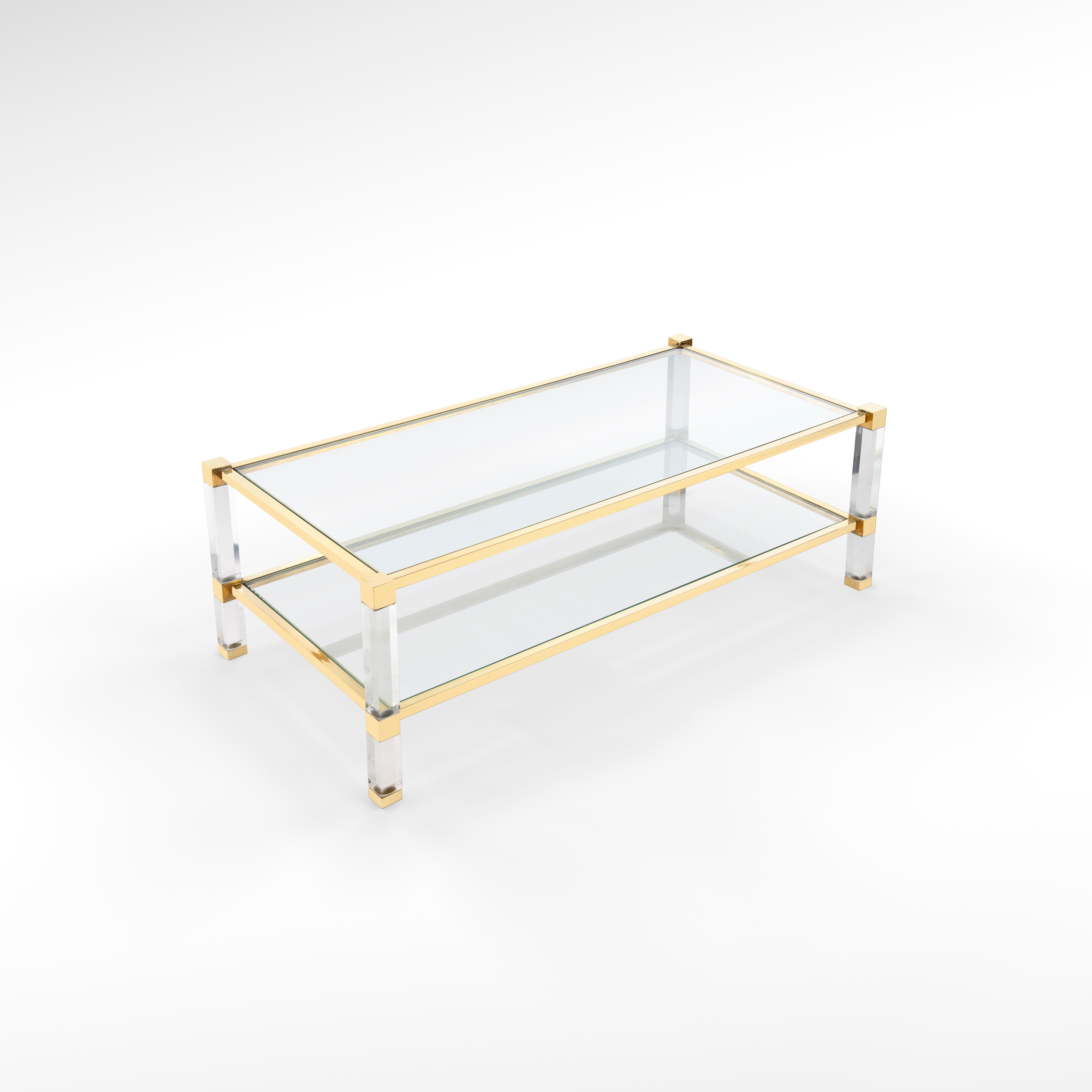 Timeless brass & plexiglass/ acrylic coffee table with glass top & shelf.
Translucent as Moonlight, this plexiglass and brass coffee table will make your space shimmer with elegance. It’s the perfect piece for your home to host guests with a touch
