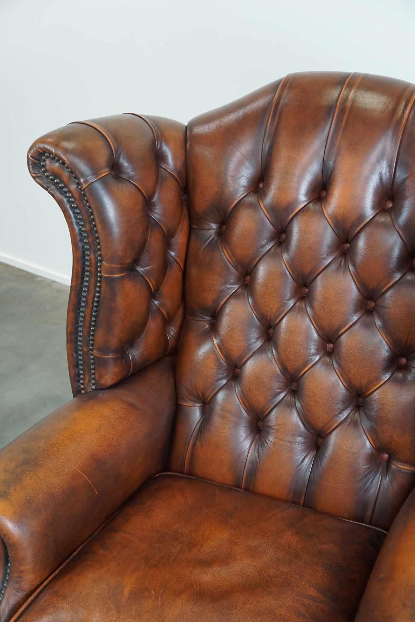 Timeless cognac-colored English cowhide Chesterfield wingback armchair in good c For Sale 4