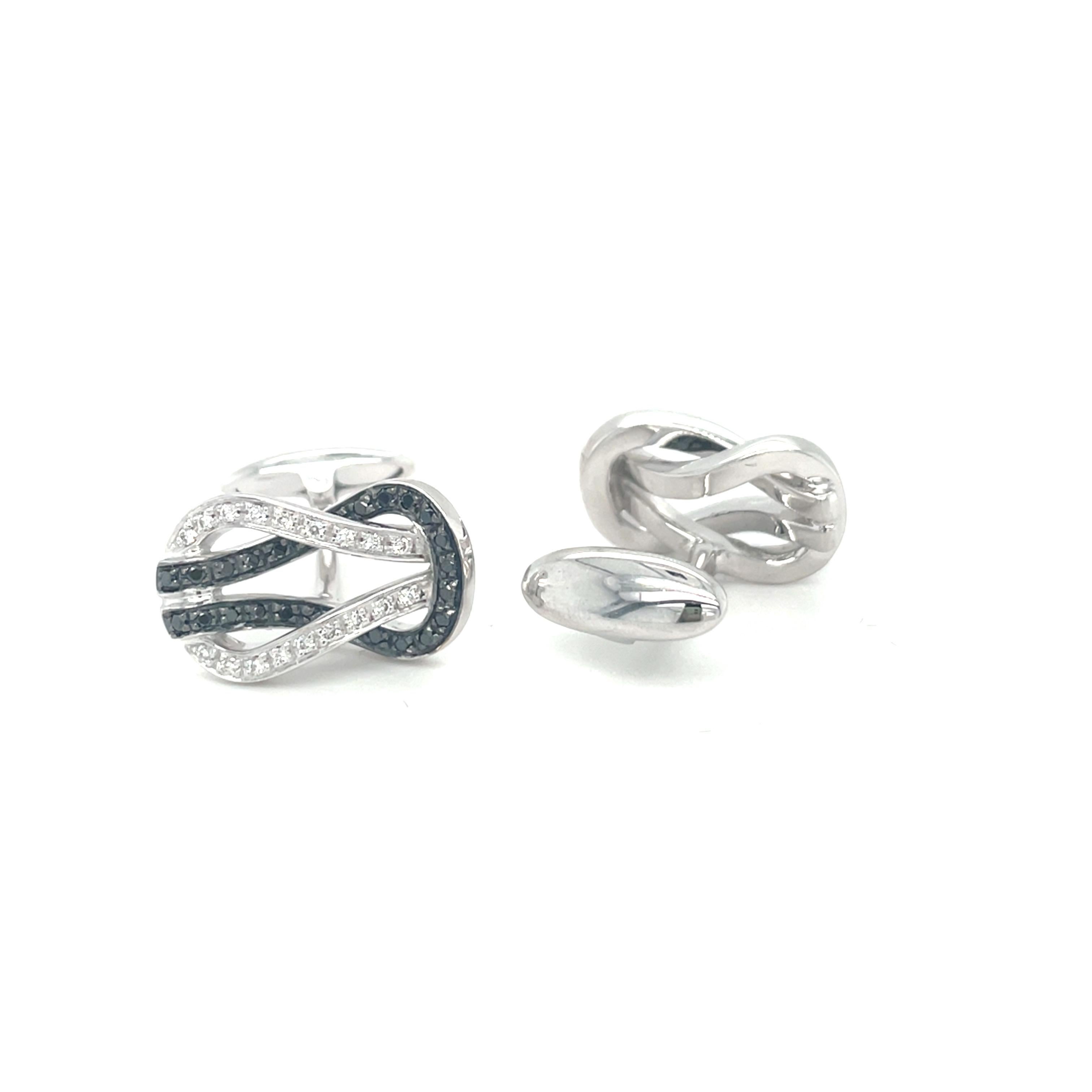 These white gold cufflinks are from Men's Collection. These cufflinks are decorated with White gold, diamond G color VS clarity 0.28 ct and black diamonds 0.42ct. The dimensions of the cufflinks are 2cm x 1.2cm. These cufflinks are a perfect upgrade