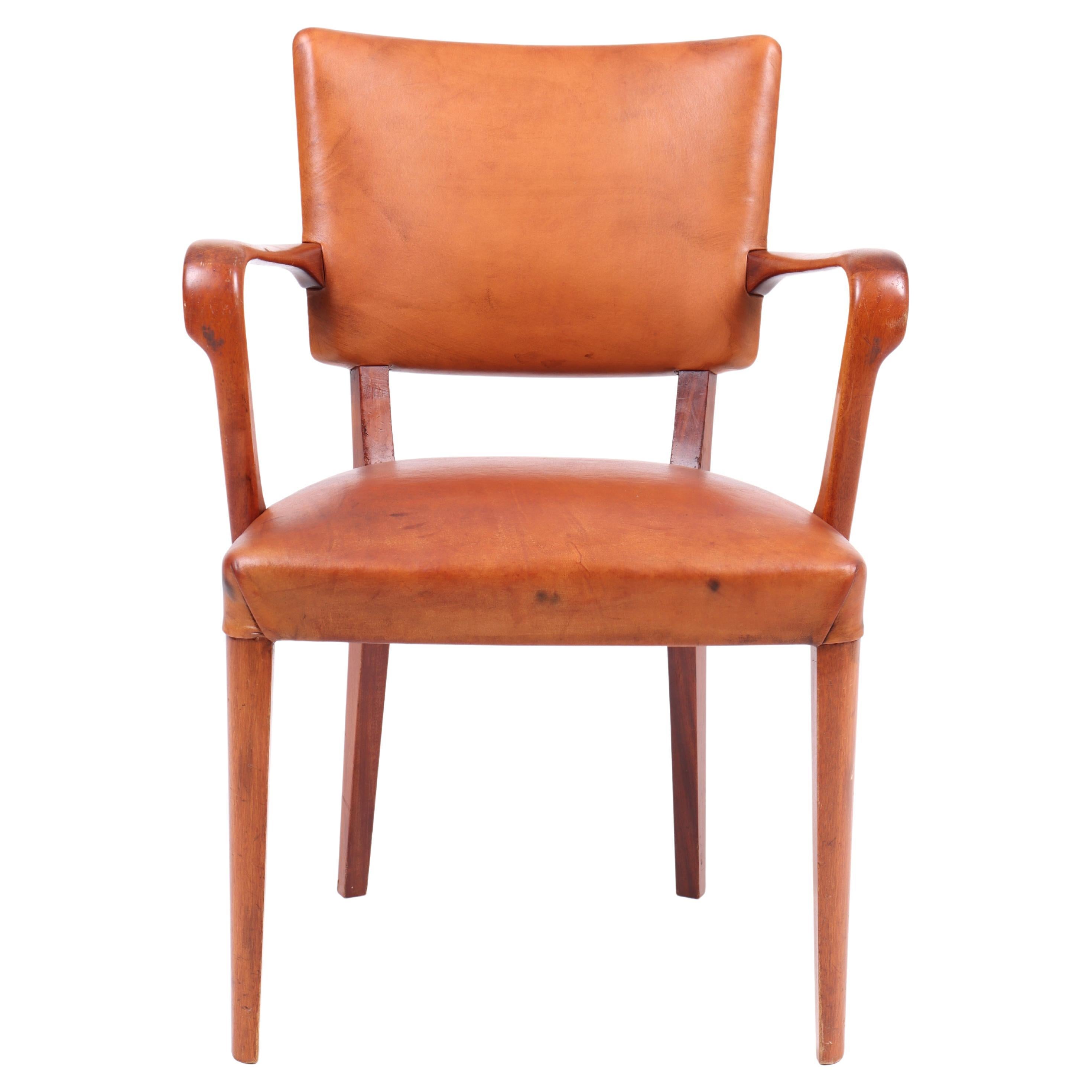 "Timeless Danish Armchair: Walnut & Leather Elegance for Stylish Comfort."