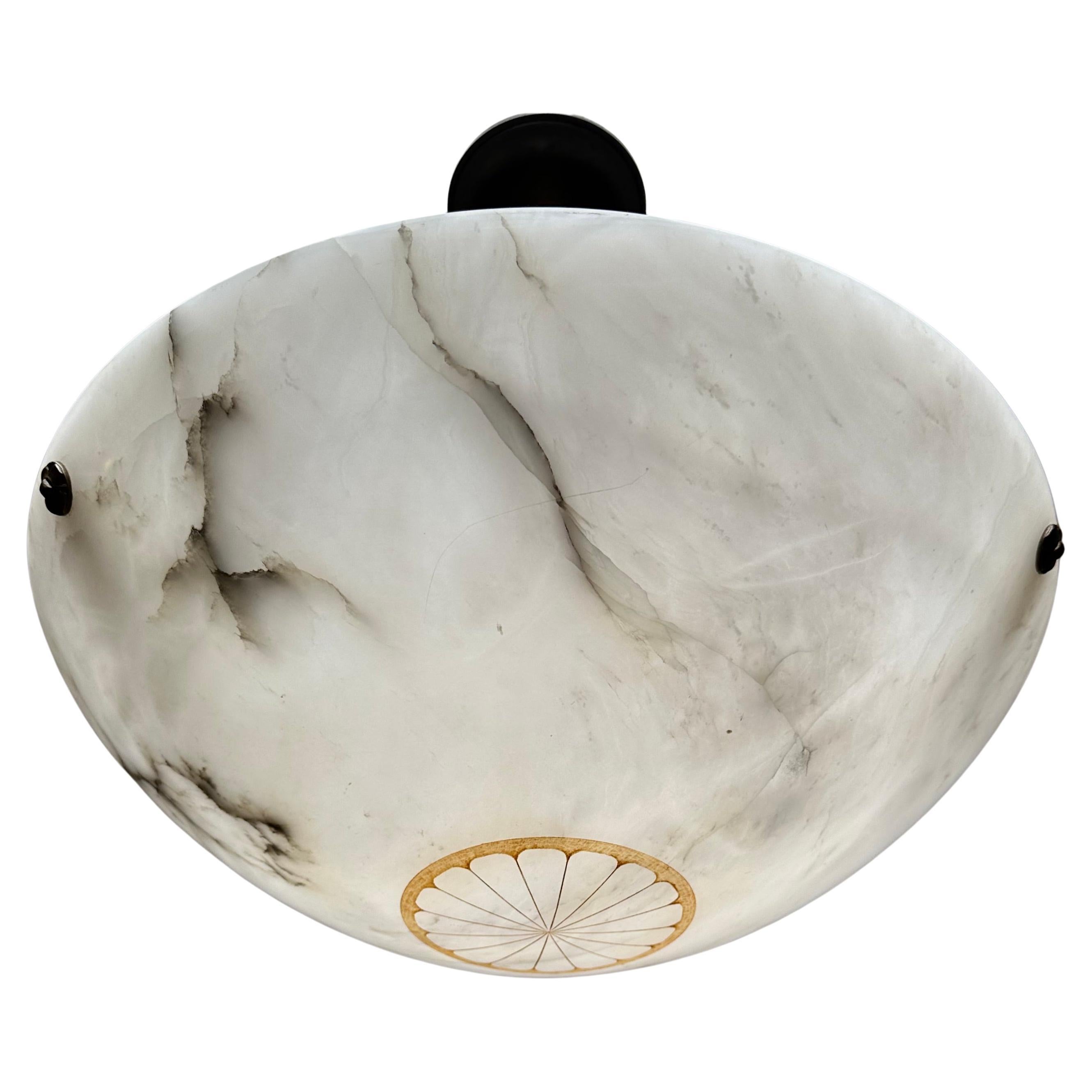 Large size (20.7 inches) and timeless, hand carved, antique alabaster pendant light.

Thanks to its 'calm' and timeless Art Deco design this alabaster chandelier will look great in all kinds of interiors. It is in good condition and the beautifully