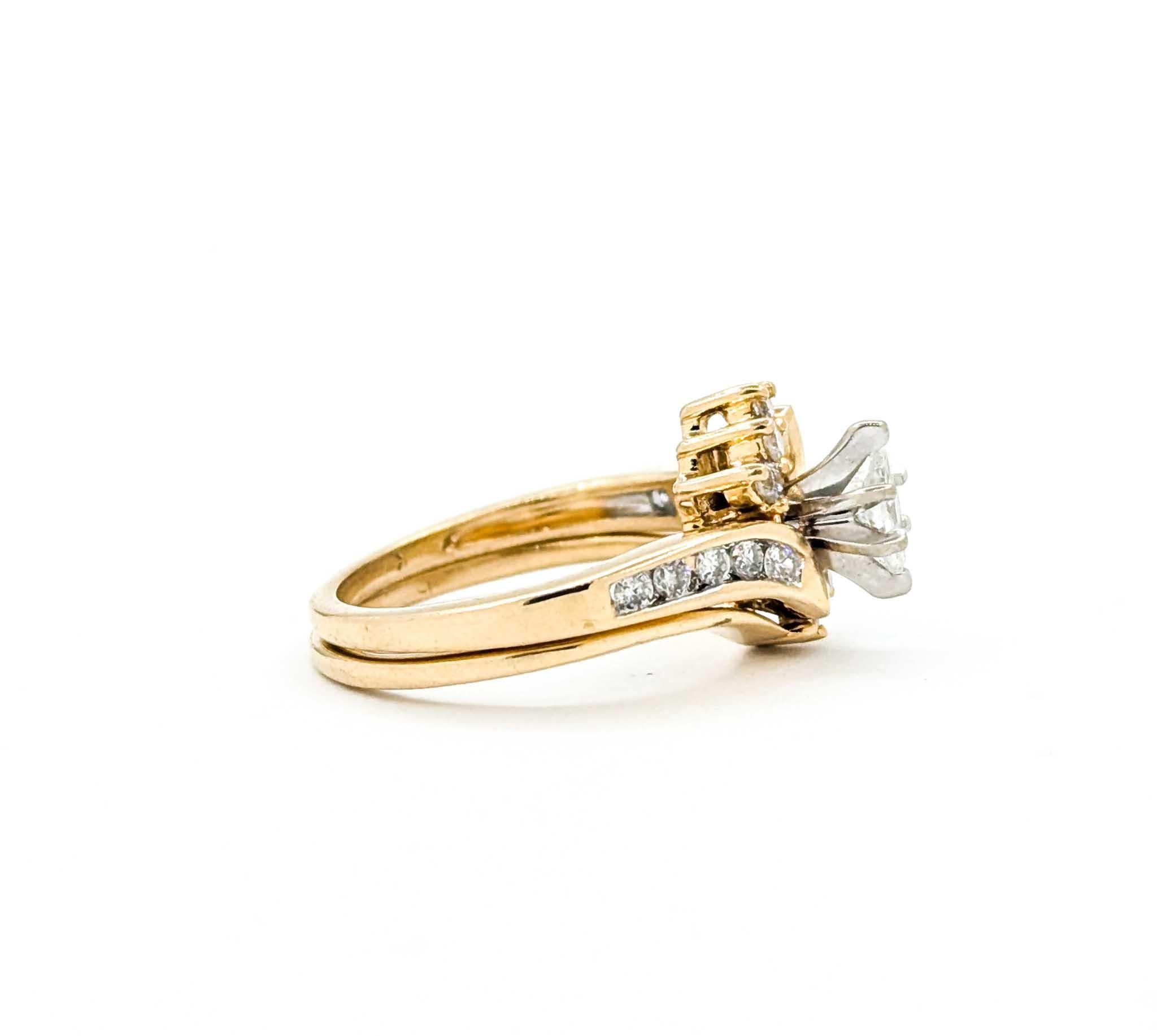 This vintage wedding set features a graceful marquise-cut diamond at the center, complemented by round brilliant diamonds for a total weight of approximately 0.25 carats. The engagement ring showcases the marquise center securely set in a classic