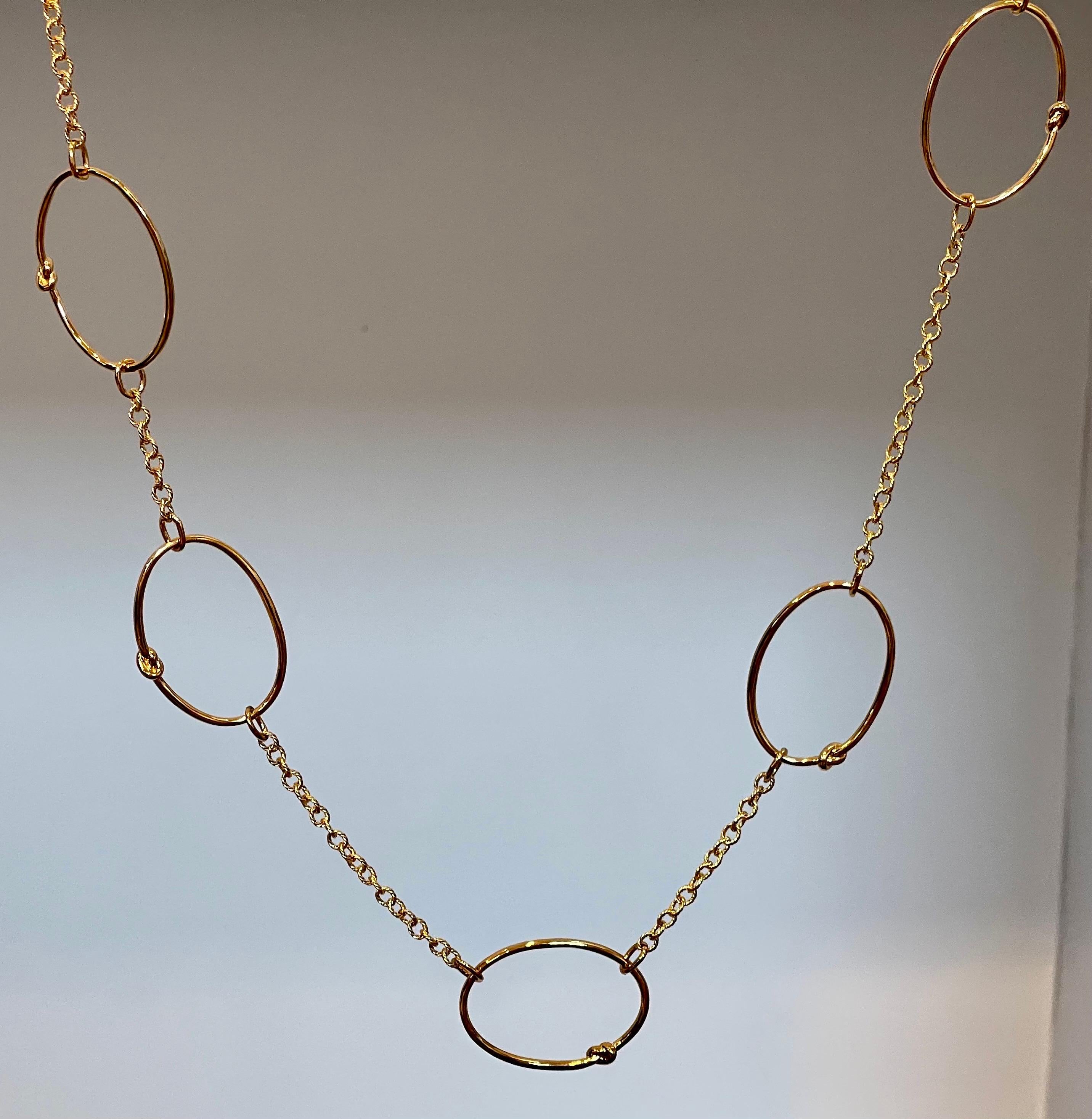 Timeless Elegance  5 Circle Sterling Silver Necklace With Gold Polish
This Necklace  is  amazing . Very Fashionable
Pure sterling silver which will not tarnish over time.
26 inch long

Weight of the bracelet is 26 grams
I guaranteed you will be