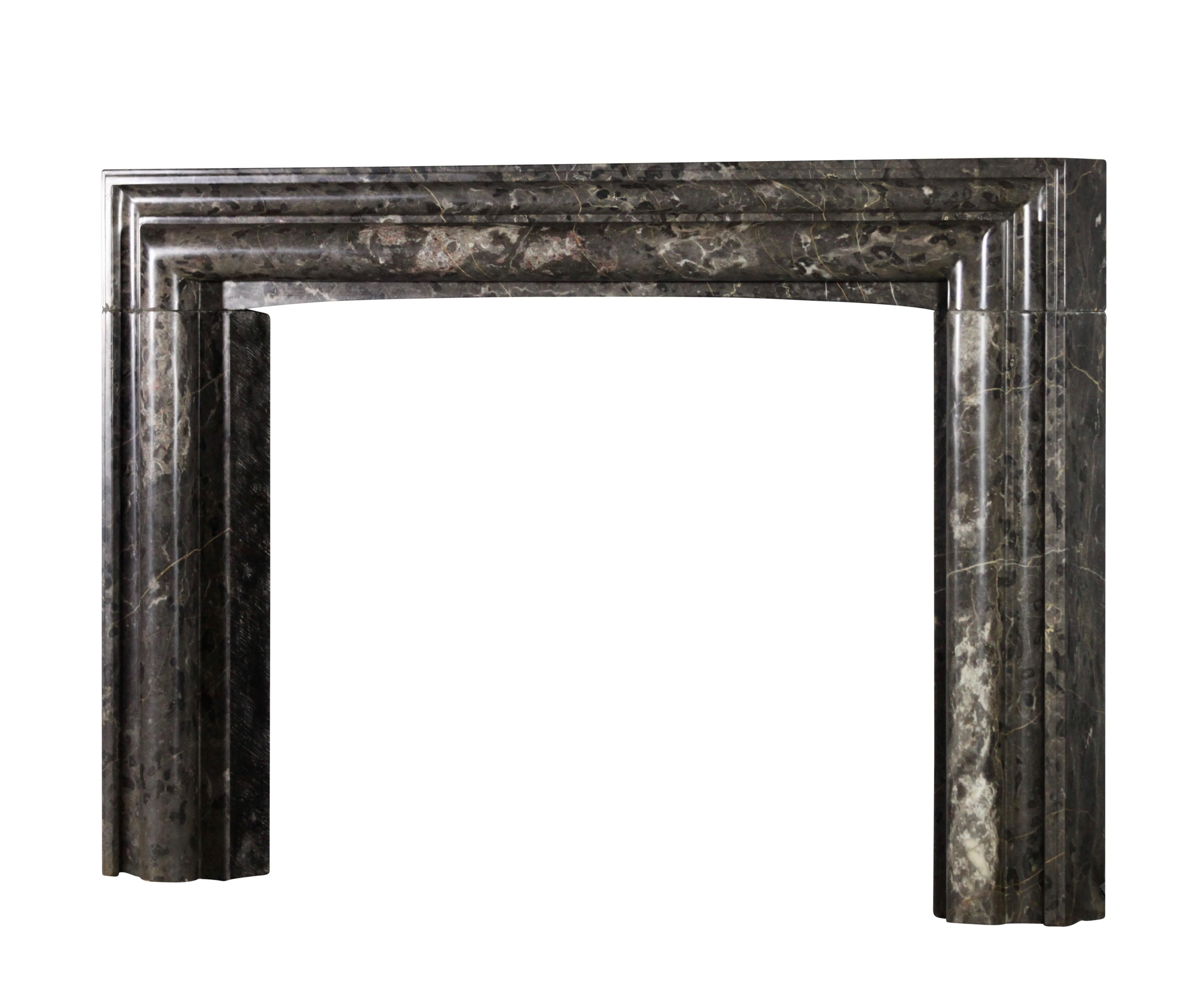 This original vintage marble fireplace surround is one of a collection of 4 that was reclaimed out of a Brussels great Maison de Maitre house of late 19th century. The colour pallet of this marble blend perfectly in different interior design styles.