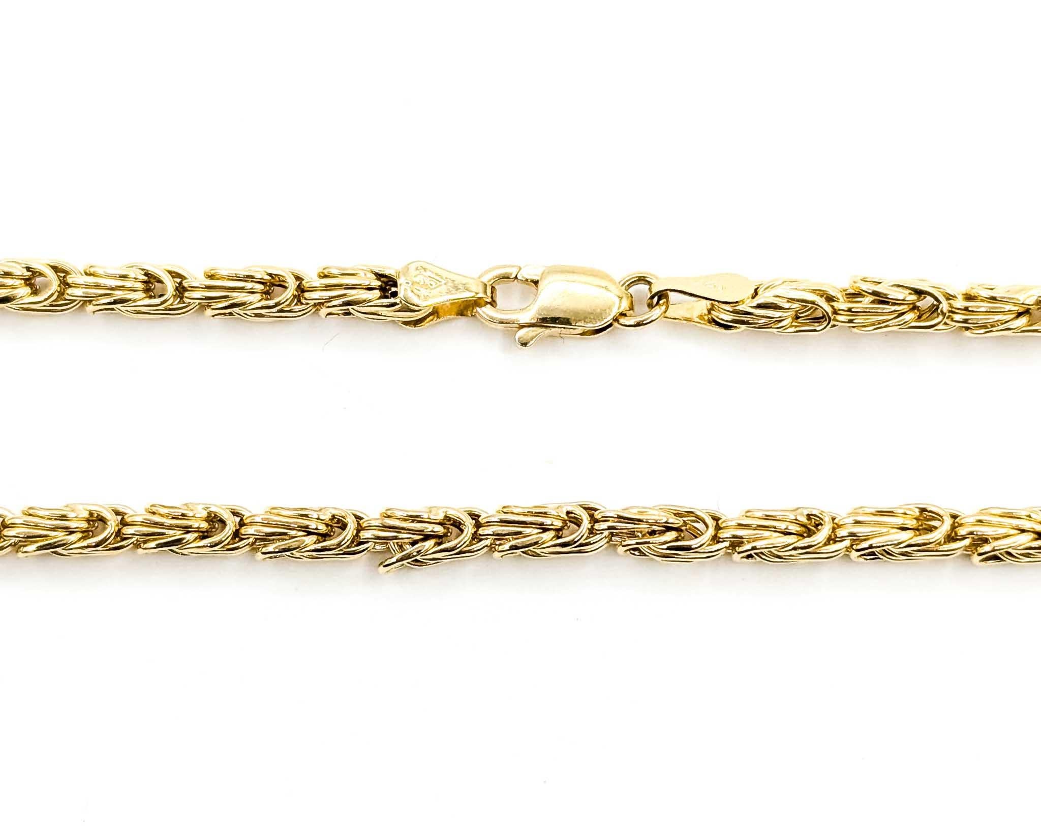 This sophisticated necklace is crafted in 14k yellow gold and designed with an intricate fancy link pattern, showcasing a rich texture and elegant flow. Measuring 18 inches in length and weighing 8.9 grams, it offers a comfortable yet substantial