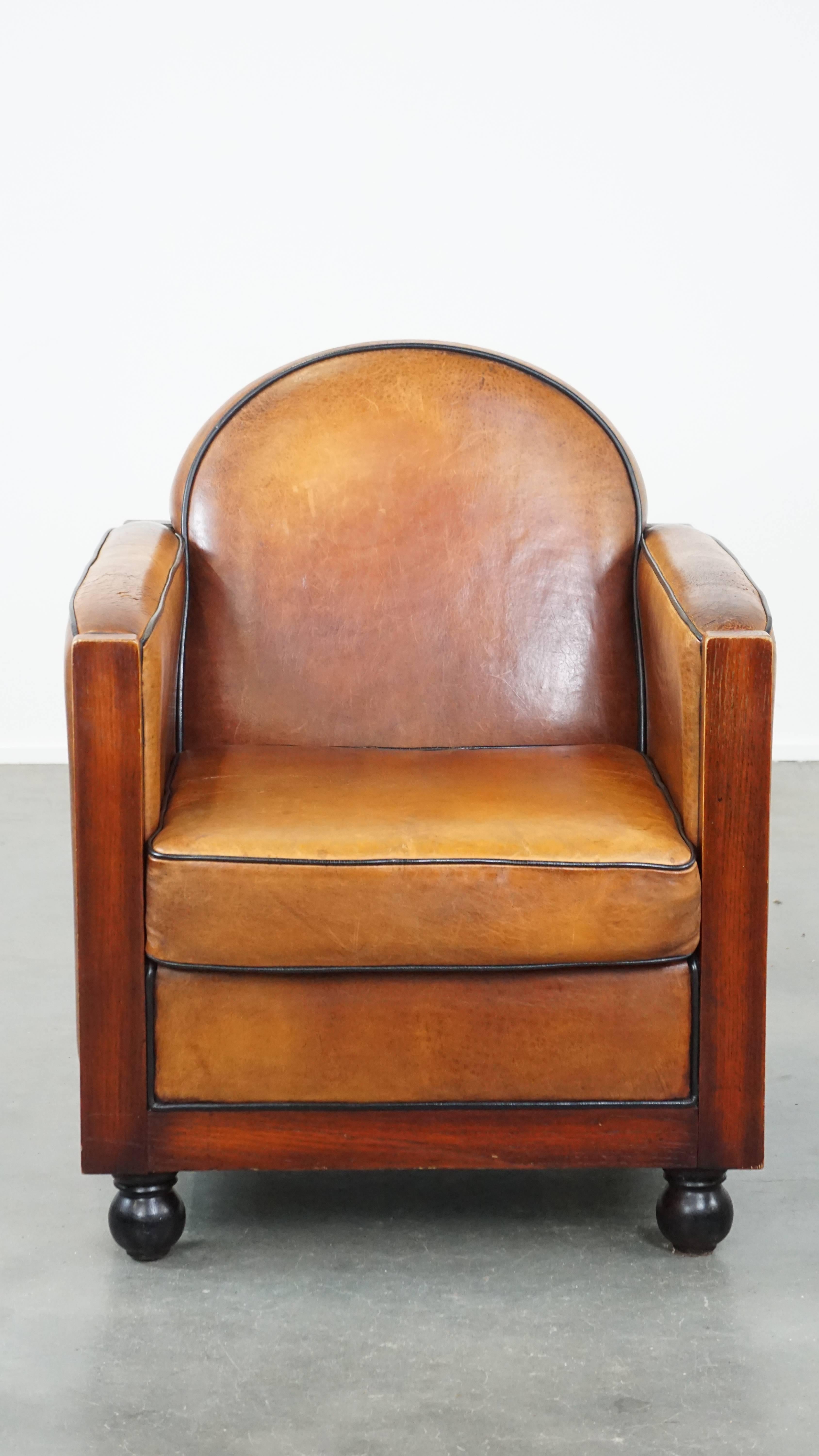 If you love Art Deco furniture, this sheep leather armchair is the perfect addition for you. This armchair shows how sleek, streamlined, and rounded shapes can effortlessly come together to create a timeless statement piece. It features wooden