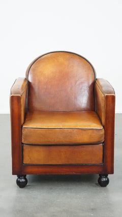 Timeless-art, fauteuil en cuir de mouton et bois design Art Deco