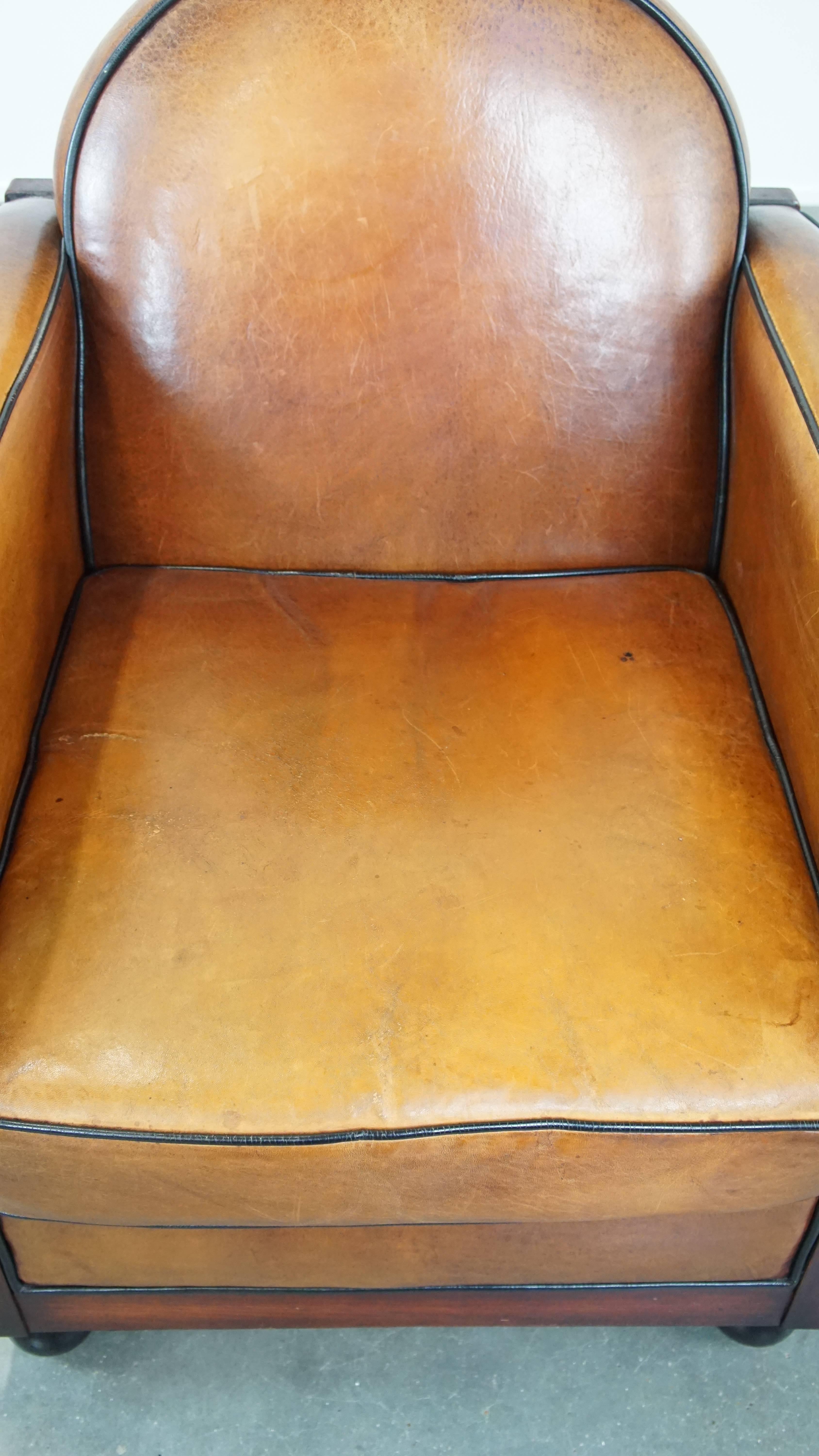 Sheepskin Timeless, finely crafted sheepskin leather and wooden Art Deco design armchair For Sale