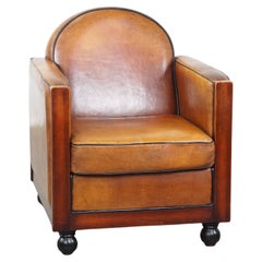 Timeless-art, fauteuil en cuir de mouton et bois design Art Deco