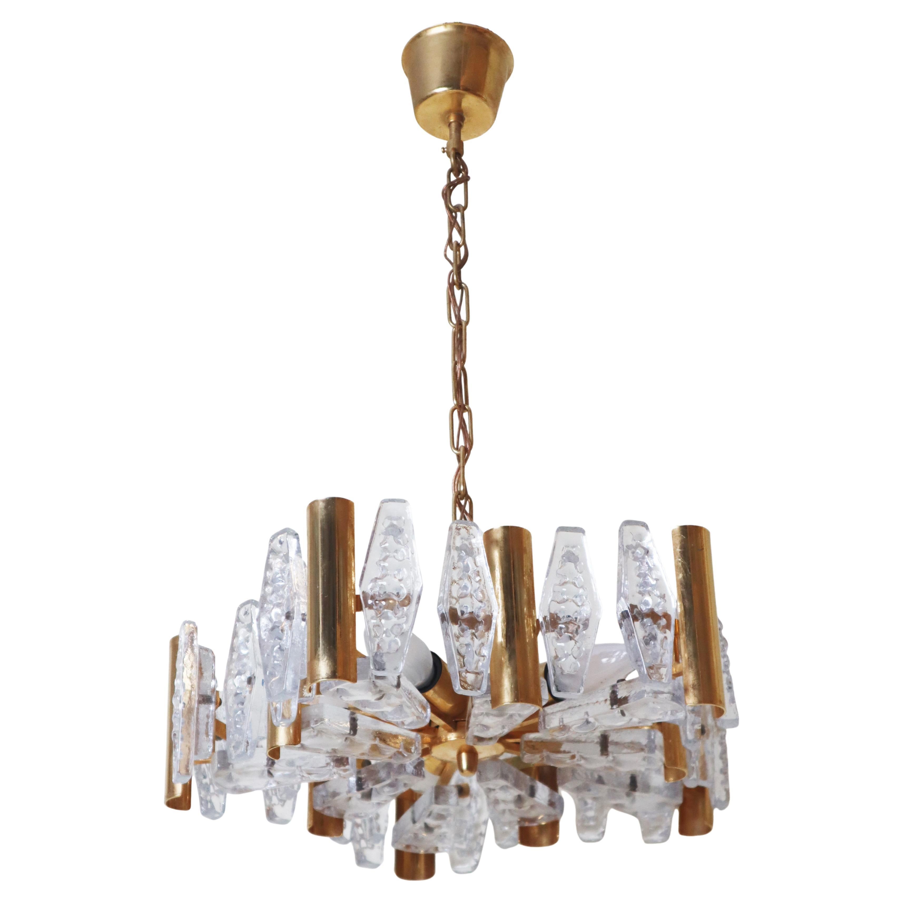 Timeless gilded chandelier made of crystal glass by Orrefors Sweden For Sale