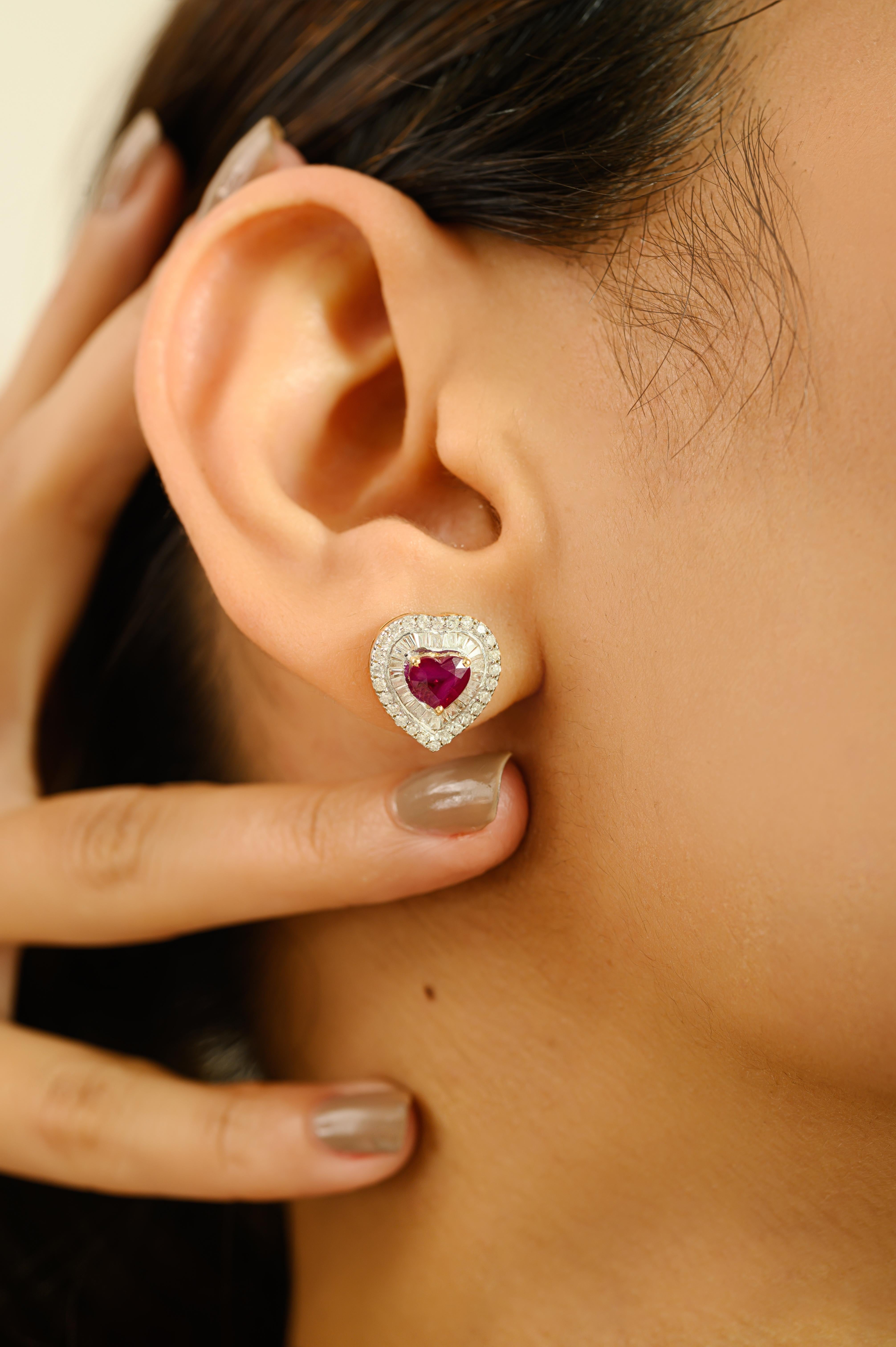 Add a touch of romance and brilliance with these heart-shaped stud earrings crafted in 14k yellow gold. Each earring features a vivid 1.52-carat total weight of heart-cut rubies, elegantly framed by a double halo of shimmering round and baguette-cut