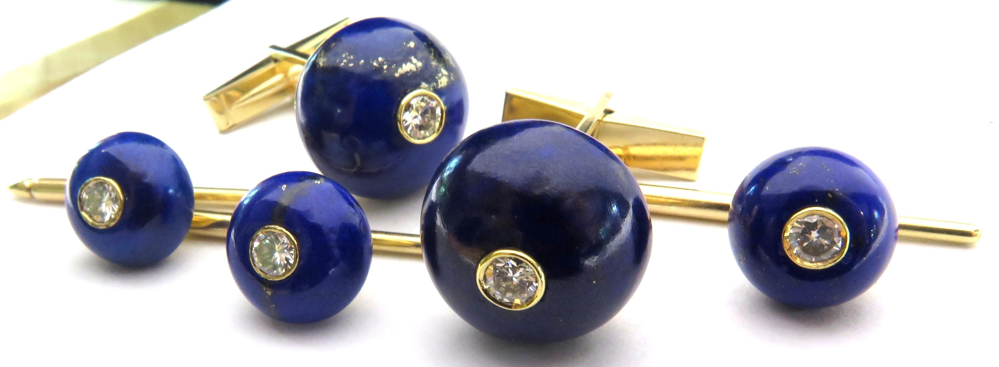 This incredible stud set made by Julius Cohen is pure elegance. The buttons of lapis lazuli are naturally enhanced with iron pyrite throughout the lapis. This stud set contains 1 pair of cufflinks and 3 studs each containing 1 full cut bezel set