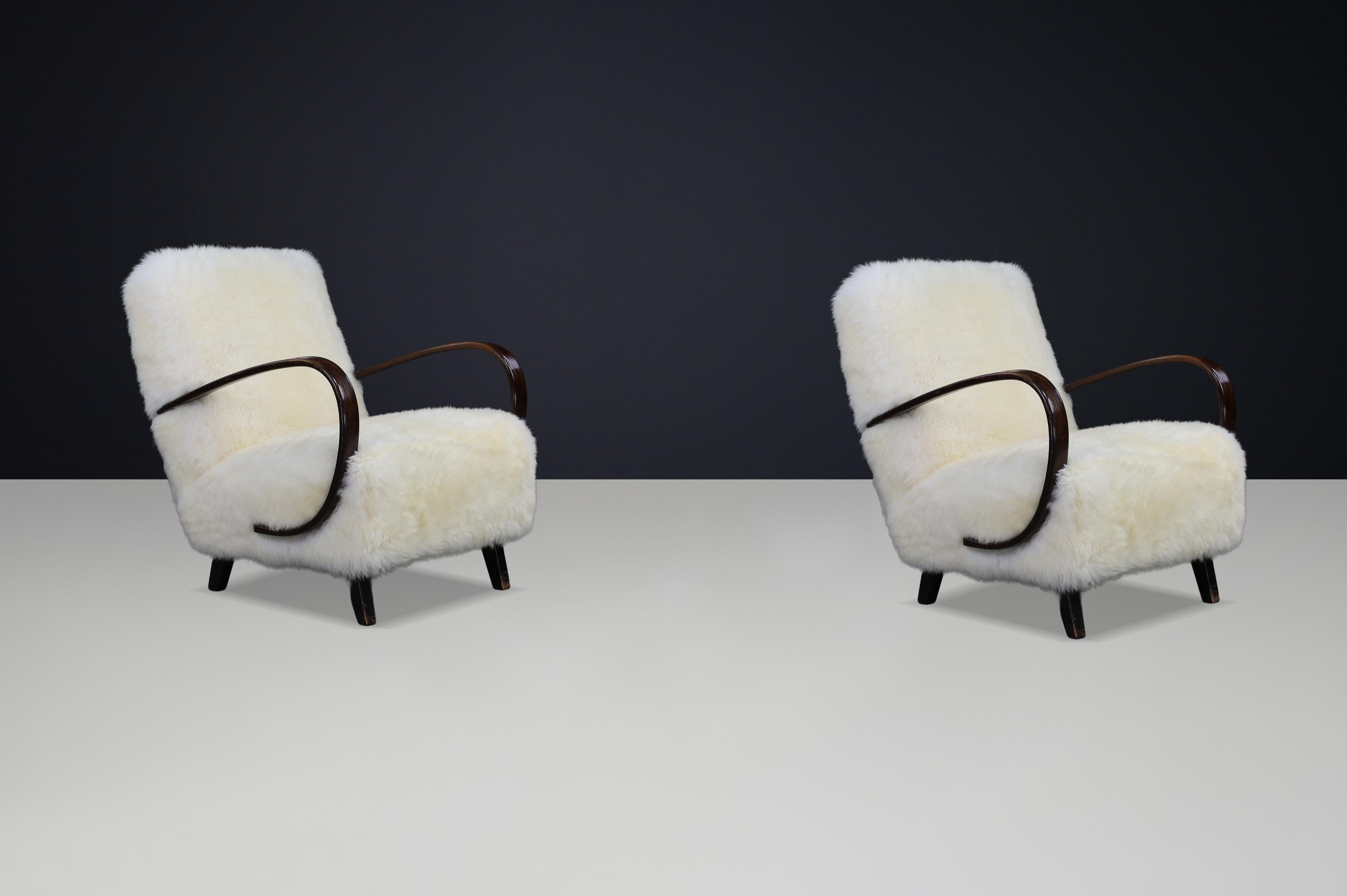 Czech Timeless Pair of Jindřich Halabala Mid-Century Modern Sheepskin Lounge Chairs For Sale