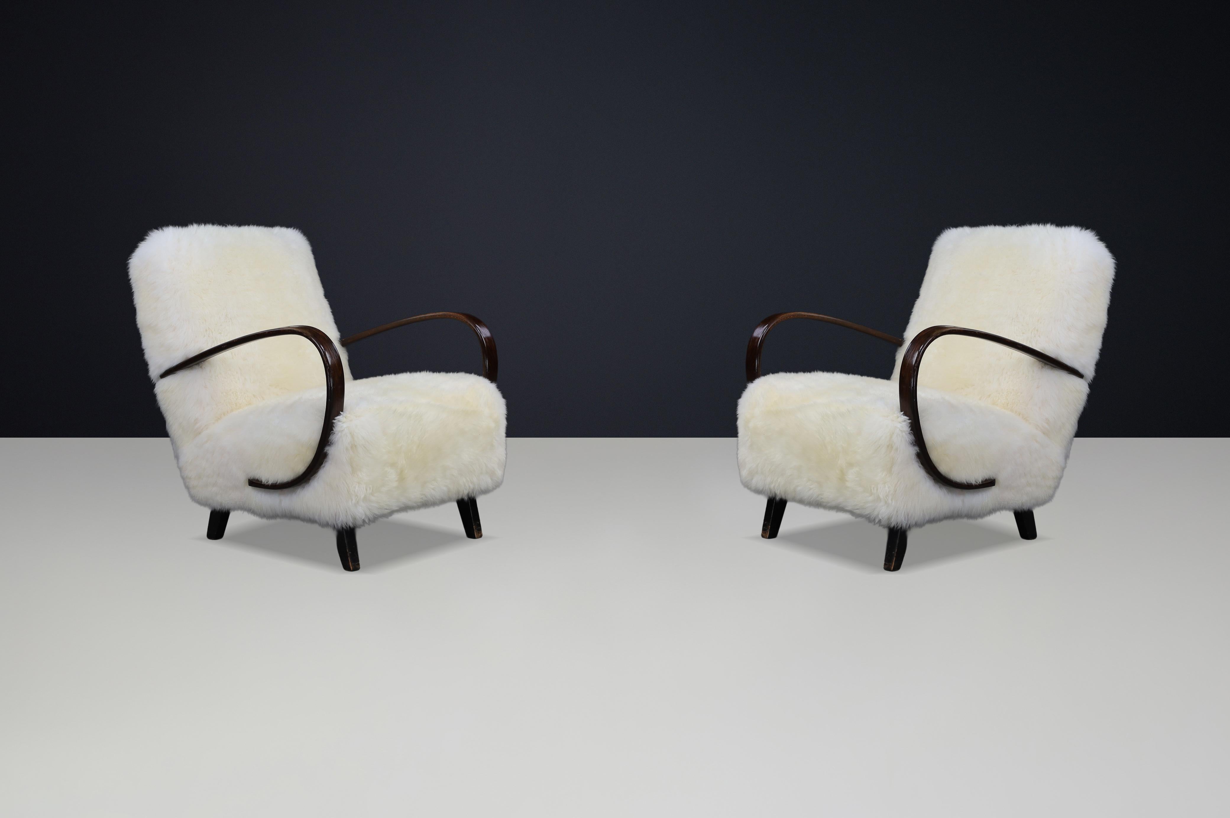 20th Century Timeless Pair of Jindřich Halabala Mid-Century Modern Sheepskin Lounge Chairs For Sale