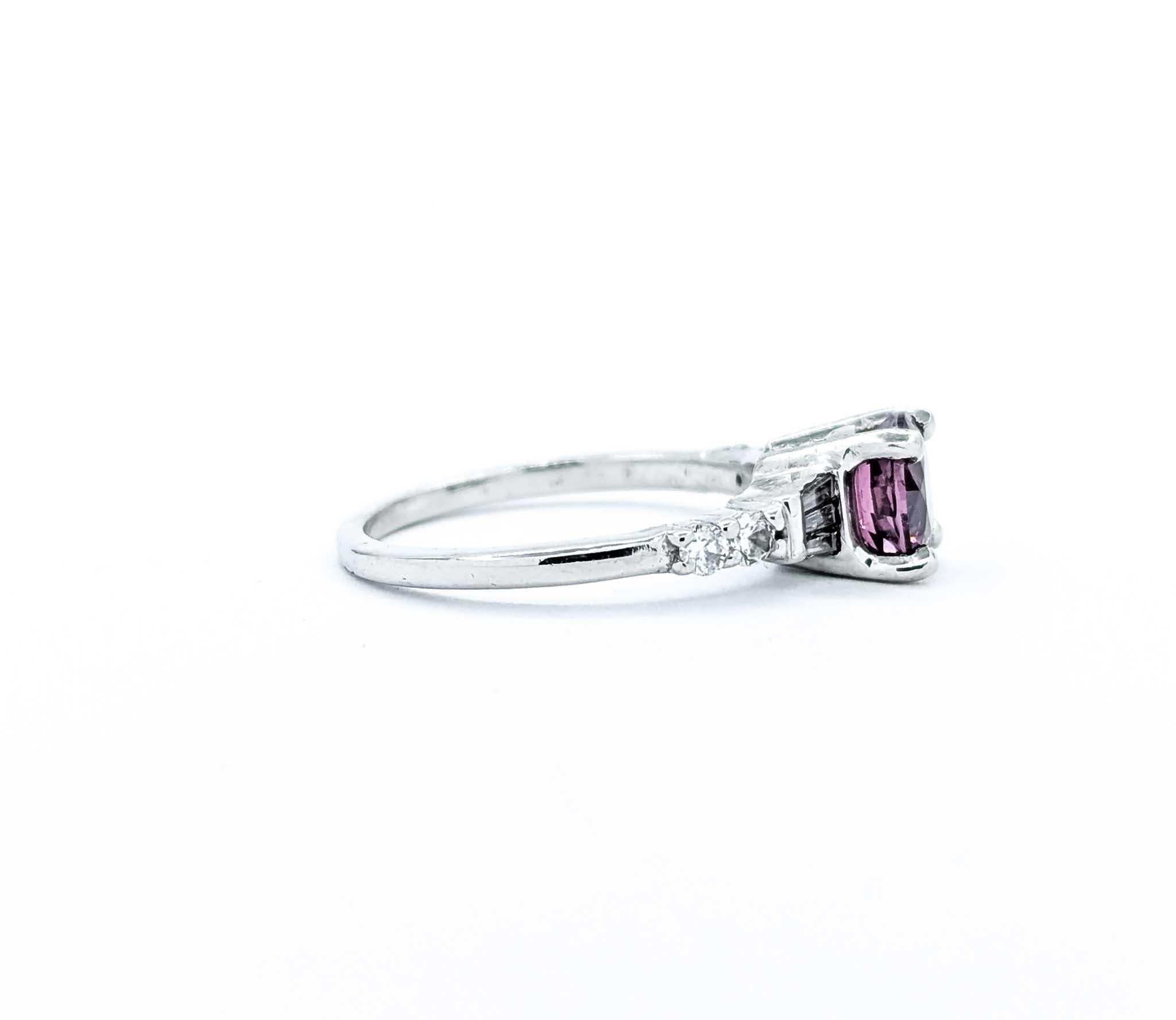 Introducing this exquisite Spinel ring crafted in 14k white gold, showcasing a harmonious blend of classic elegance and modern allure. The centerpiece is a stunning 1.30-carat raspberry Spinel, its vivid hue reminiscent of the most luscious berries.