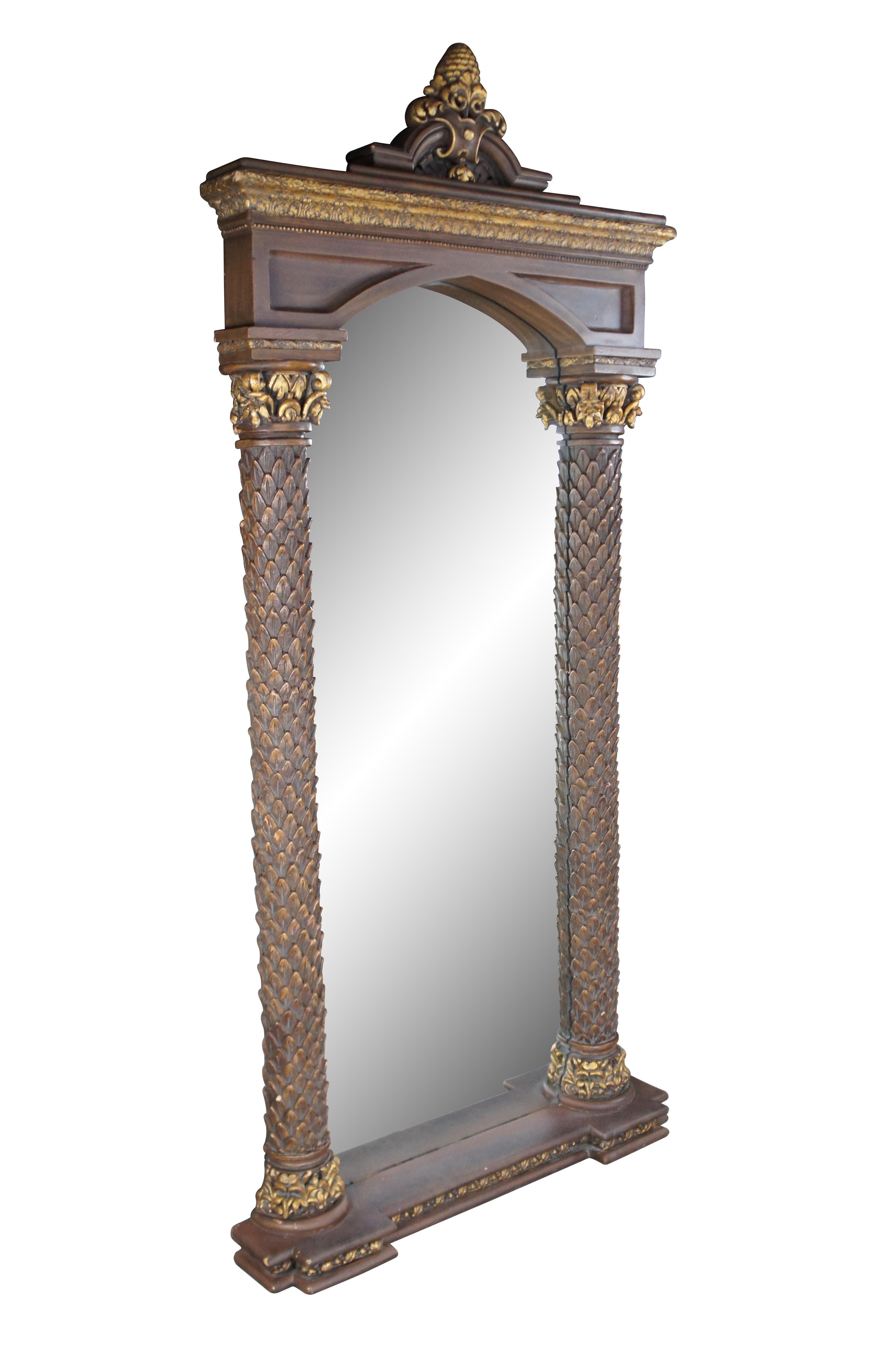 Timeless Reflections Regency style mirror, circa last quarter 20th century.  Features two ornate columns with gold acanthus accents and pineapple / fleur de list crown.  Made by Timeless Industries in Mexico

Dimensions:
37