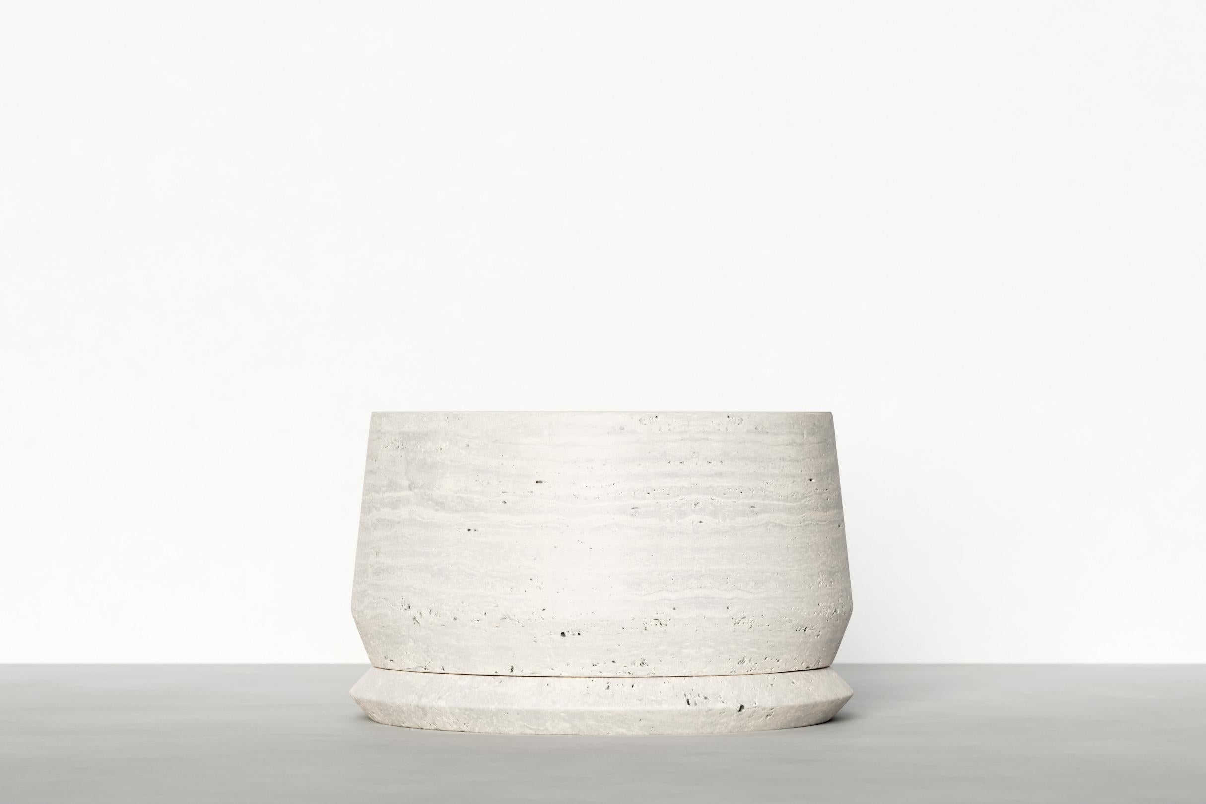 Timeless side table III by Maria Osminina
Limited Edition of 12
Dimensions: 50 x 50 x 30 cm
Materials: Travertino Romano

Timeless is a series of pieces of stone furniture in which the aesthetic vector is aimed at a deep sense of time as being. It