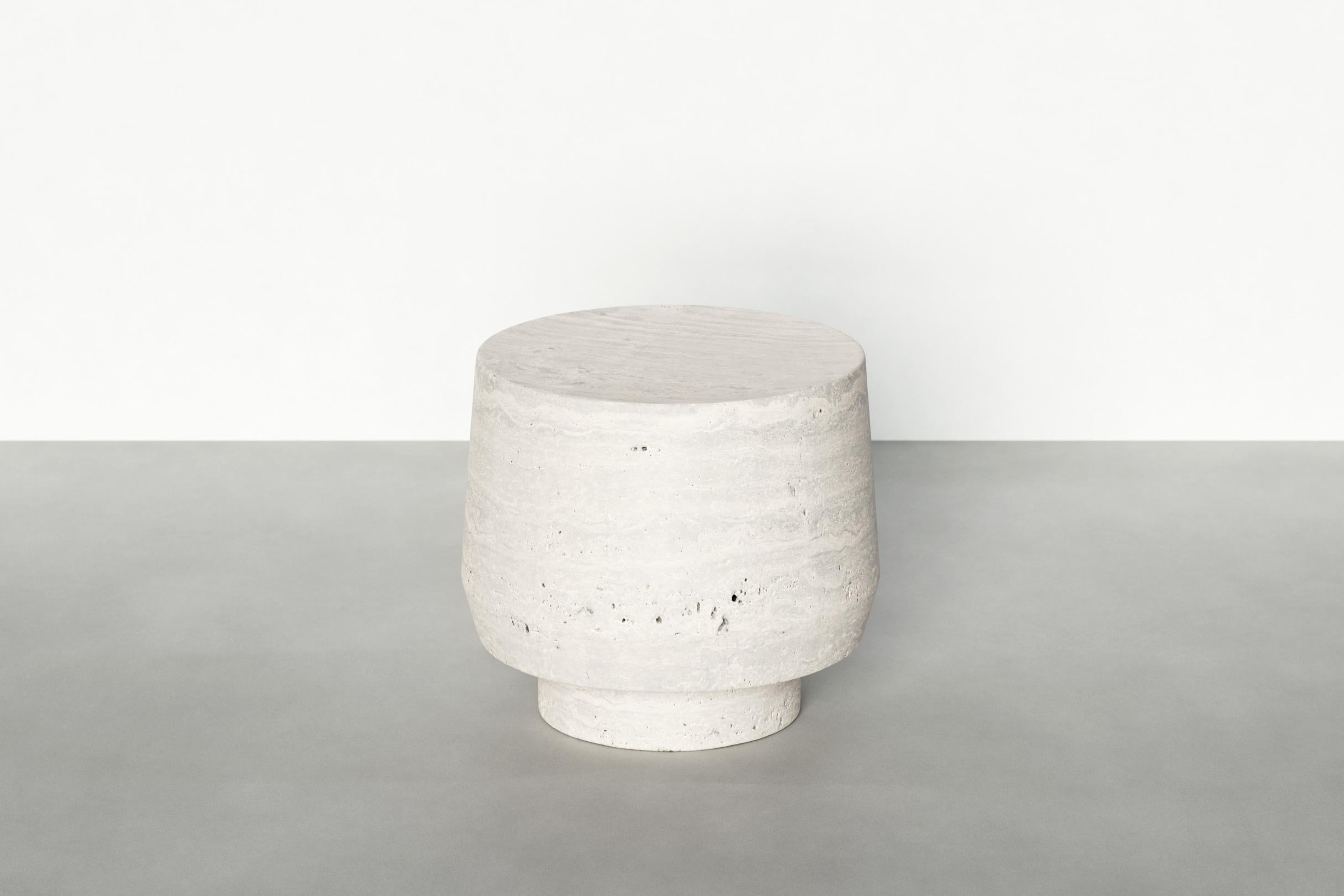 Timeless side table VI by Maria Osminina
Limited Edition of 12
Dimensions: 42 x 42 x 37 cm
Materials: Travertino Romano

Timeless is a series of pieces of stone furniture in which the aesthetic vector is aimed at a deep sense of time as being. It is