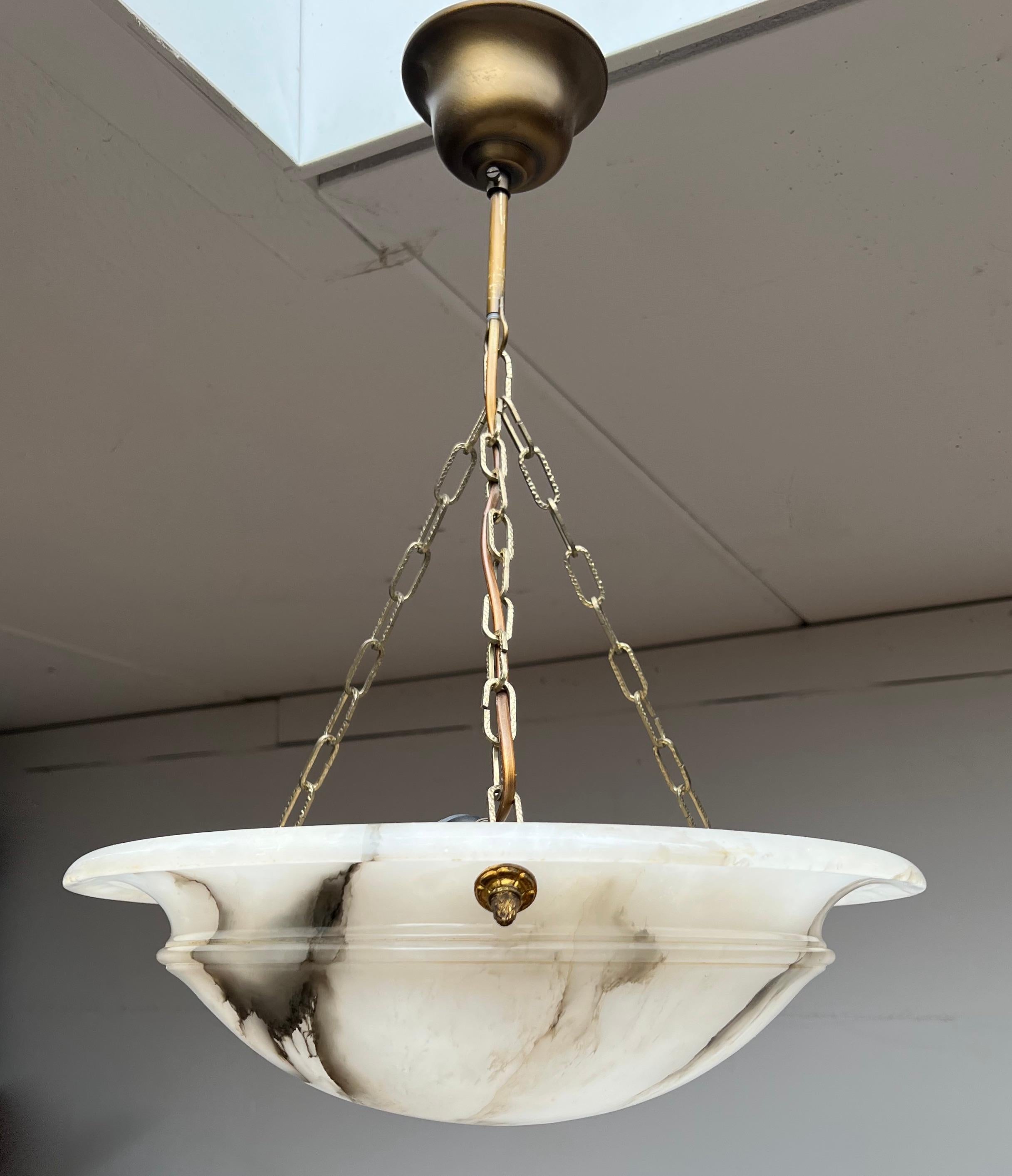 French Art Deco elegance for interior designers who wish to impress their clients.

If you are looking for a beautiful, timeless, impressive and ready to use alabaster chandelier then this striking French light from circa 1920 could be gracing