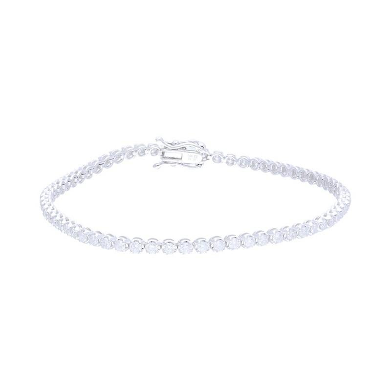 Diamond Total Carat Weight: This exquisite Timeless Tennis bracelet showcases a total carat weight of 2 carats, featuring 66 excellent round diamonds that create a stunning and timeless piece of jewelry.

Round Diamonds: Sixty-six meticulously