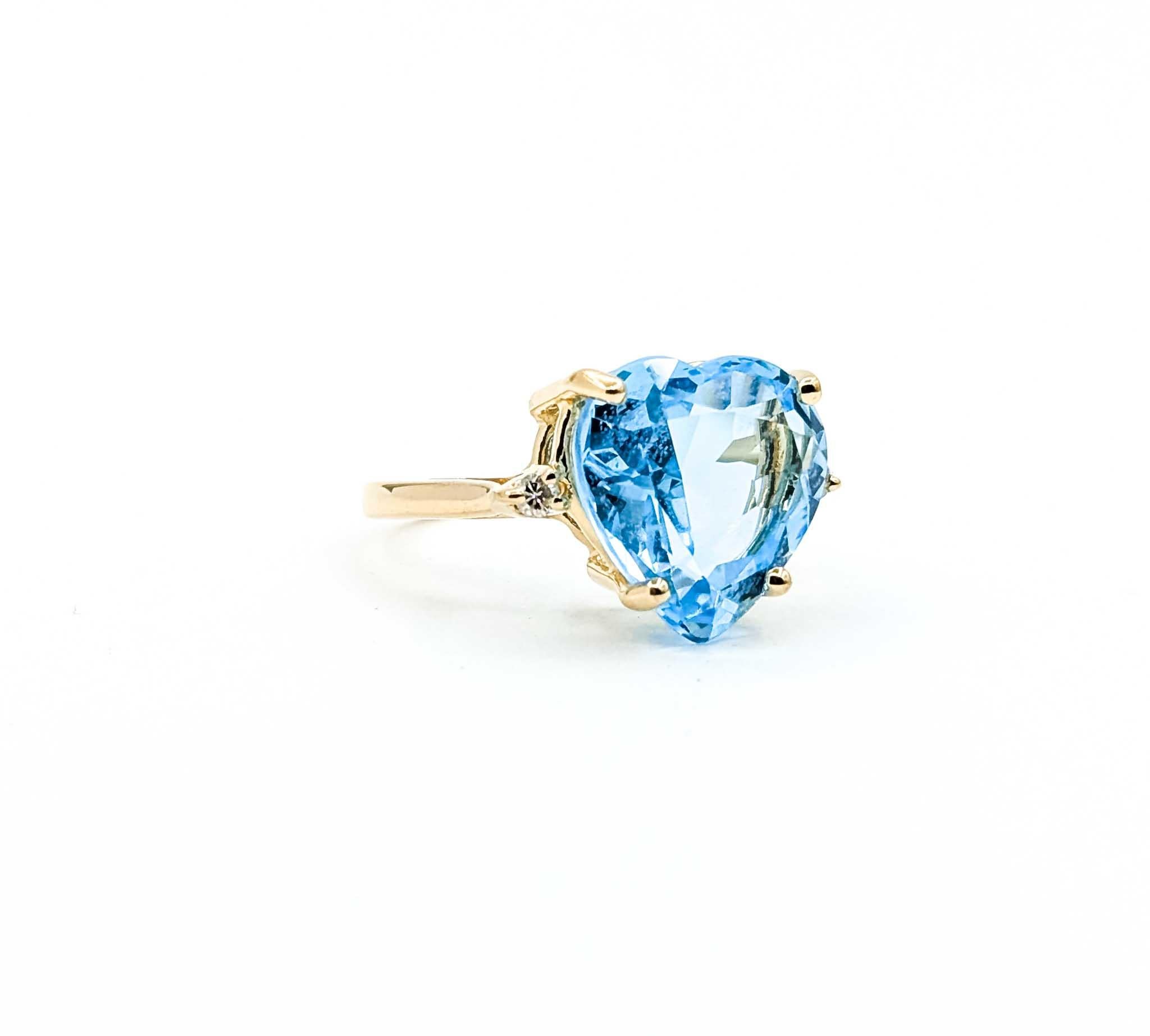 Introducing this beautiful topaz ring crafted in 14k yellow gold, the piece is a harmonious blend of elegance and contemporary style. The ring features a striking 6.5-carat topaz, which is the centerpiece of the design. Surrounding the topaz are