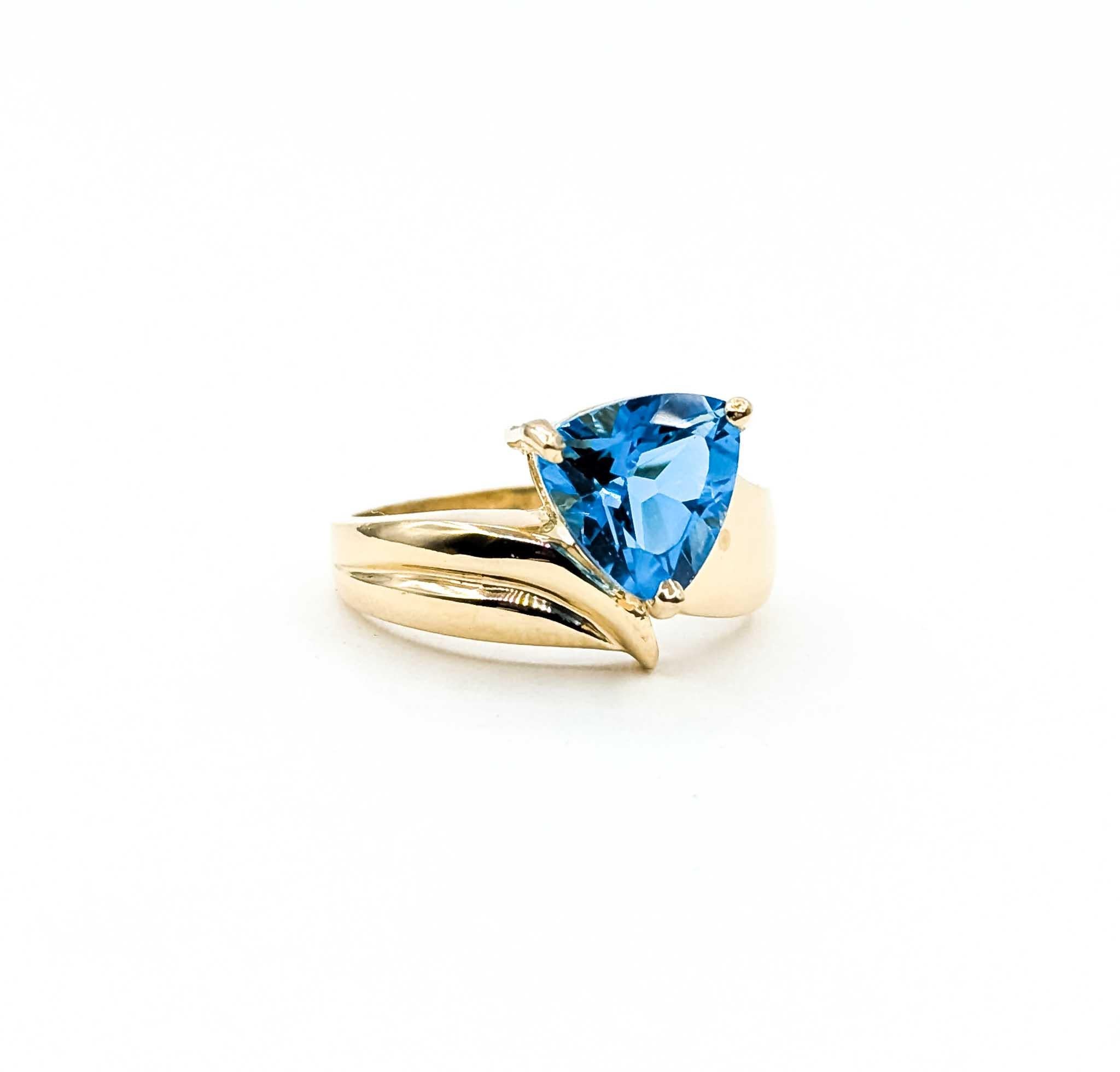 Introducing this exquisite Topaz ring crafted in 10k bypass gold, a testament to refined elegance and artistic craftsmanship. The ring showcases a stunning 3.4-carat topaz, beautifully set to enhance its natural allure. The bypass design adds a