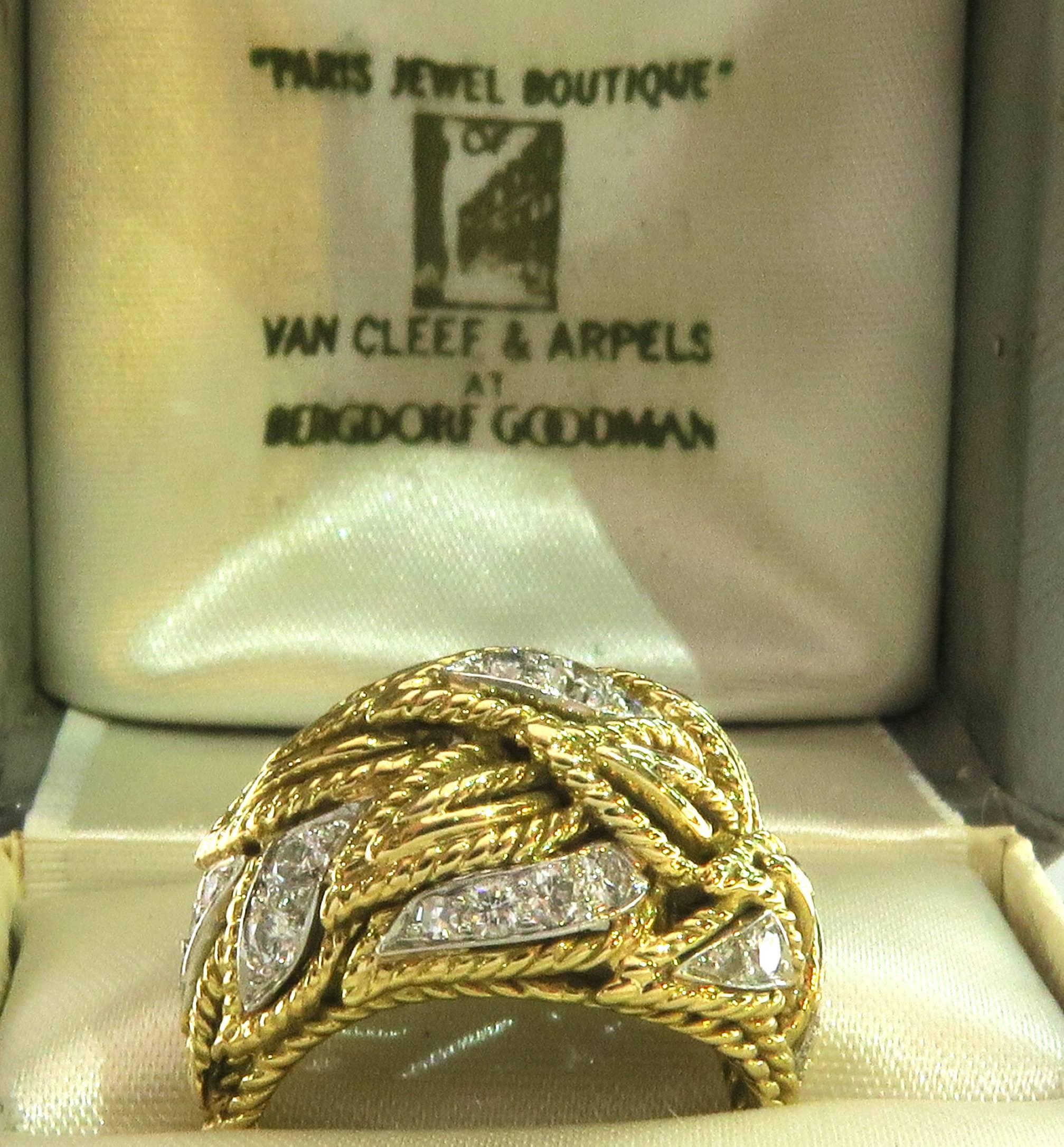 18 Karat classic Van Cleef and Arpels. This ring has Diamonds set in a layered Leaf domed design and comes in it's original box as pictured. This incredible collectible 1960's ring has everything that VCA is known for, unmatched style, design and