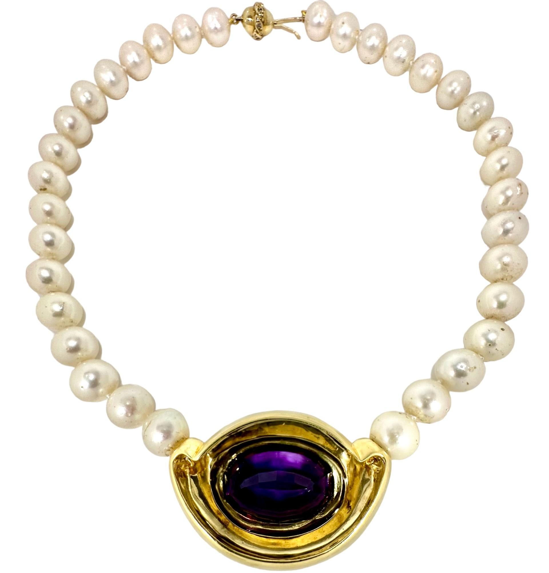 This lovely vintage choker length necklace is decidedly in the Modernist genre. A large and rich step cut amethyst weighing approximately 27.50 carats is cradled tastefully and prominently in a bombe centerpiece. Thirty four 10mm to 10.5mm Japanese
