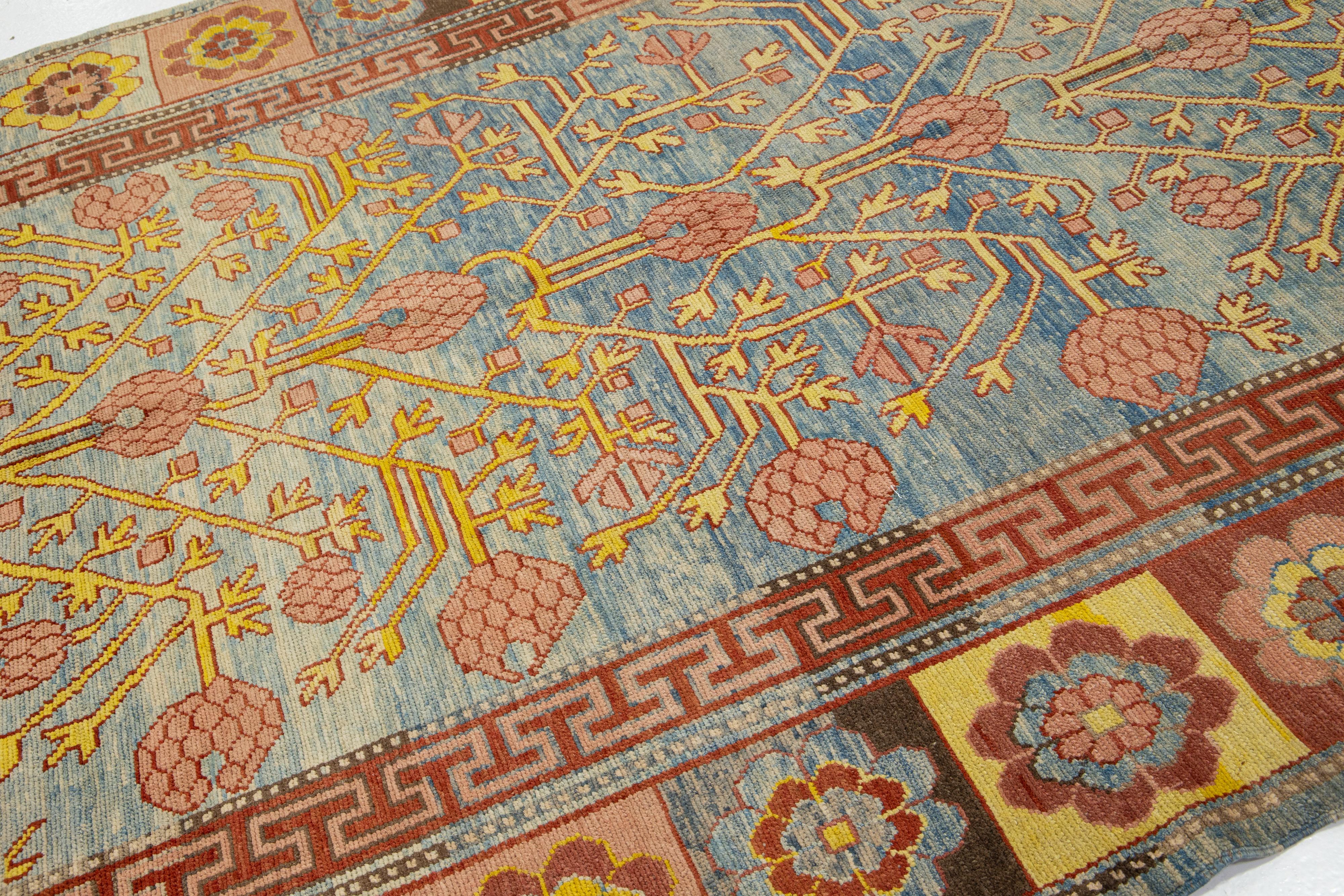 20th Century Timeless Vintage Khotan Style Blue Wool Rug Featuring an Allover Design For Sale