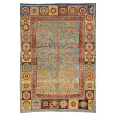 Alfombra intemporal de lana azul estilo Khotan Vintage con diseño integral