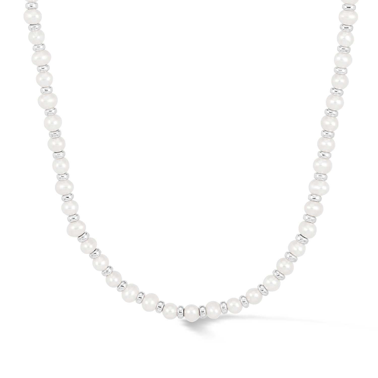 Thread by hand in our London studio, this pearl necklace will slip seamlessly into your collection of style staples. The modern mix of lustrous white freshwater pearls and shiny sterling silver beads makes it perfect for layering with other