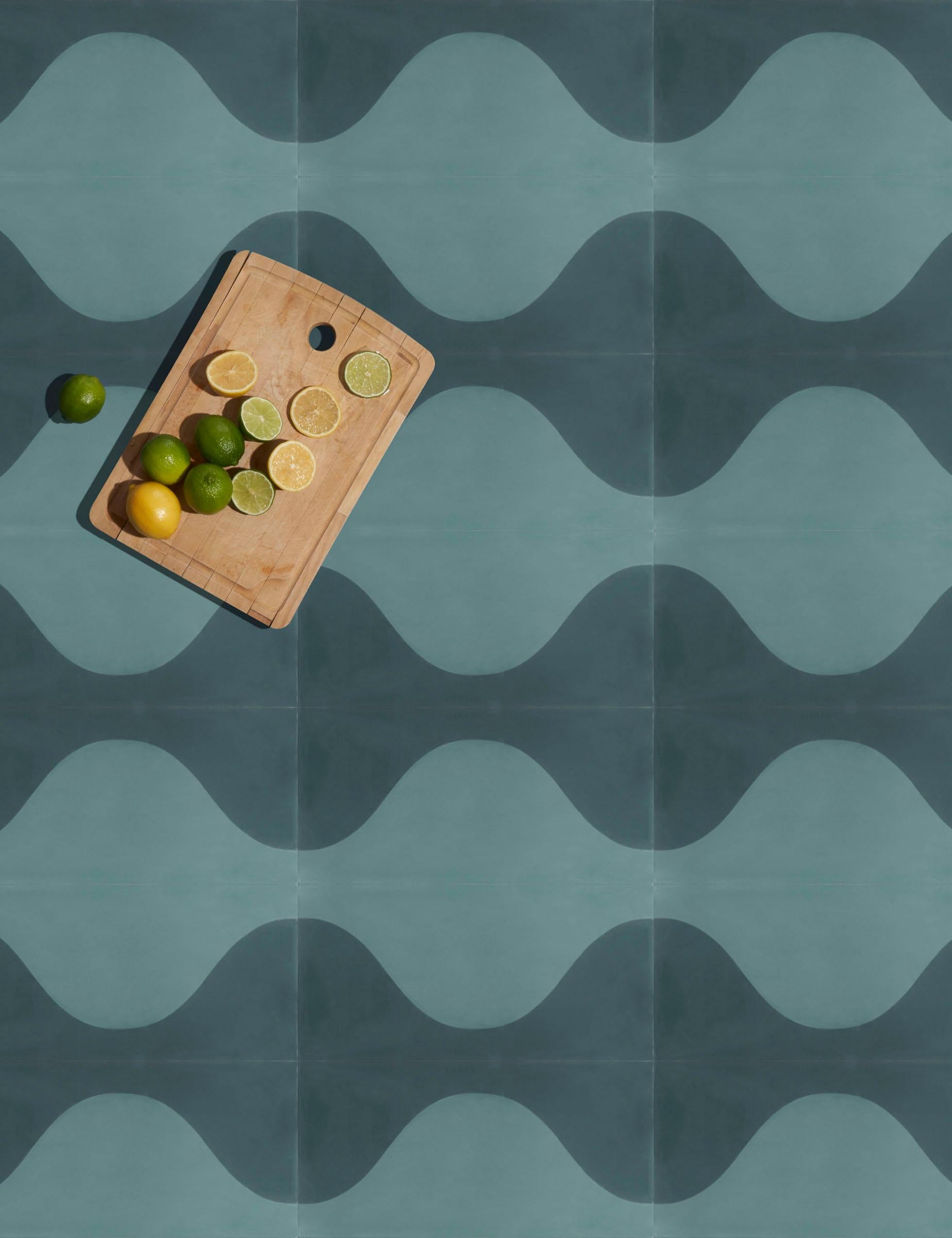 A wavy modular retro pattern that can be mixed and matched to create a dual-color or ombré pattern. 

Cement tiles
Type: Encaustic cement tile
Production process: Hydraulic pressing process
Materials: White cement, stone powder, additives, grey