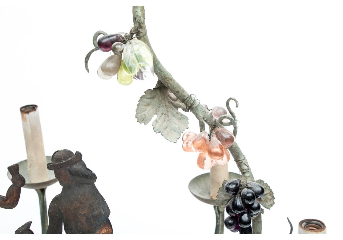 Folk Art Timeworn Tole Chandelier With Glass Grape Clusters And Figural Panel For Sale
