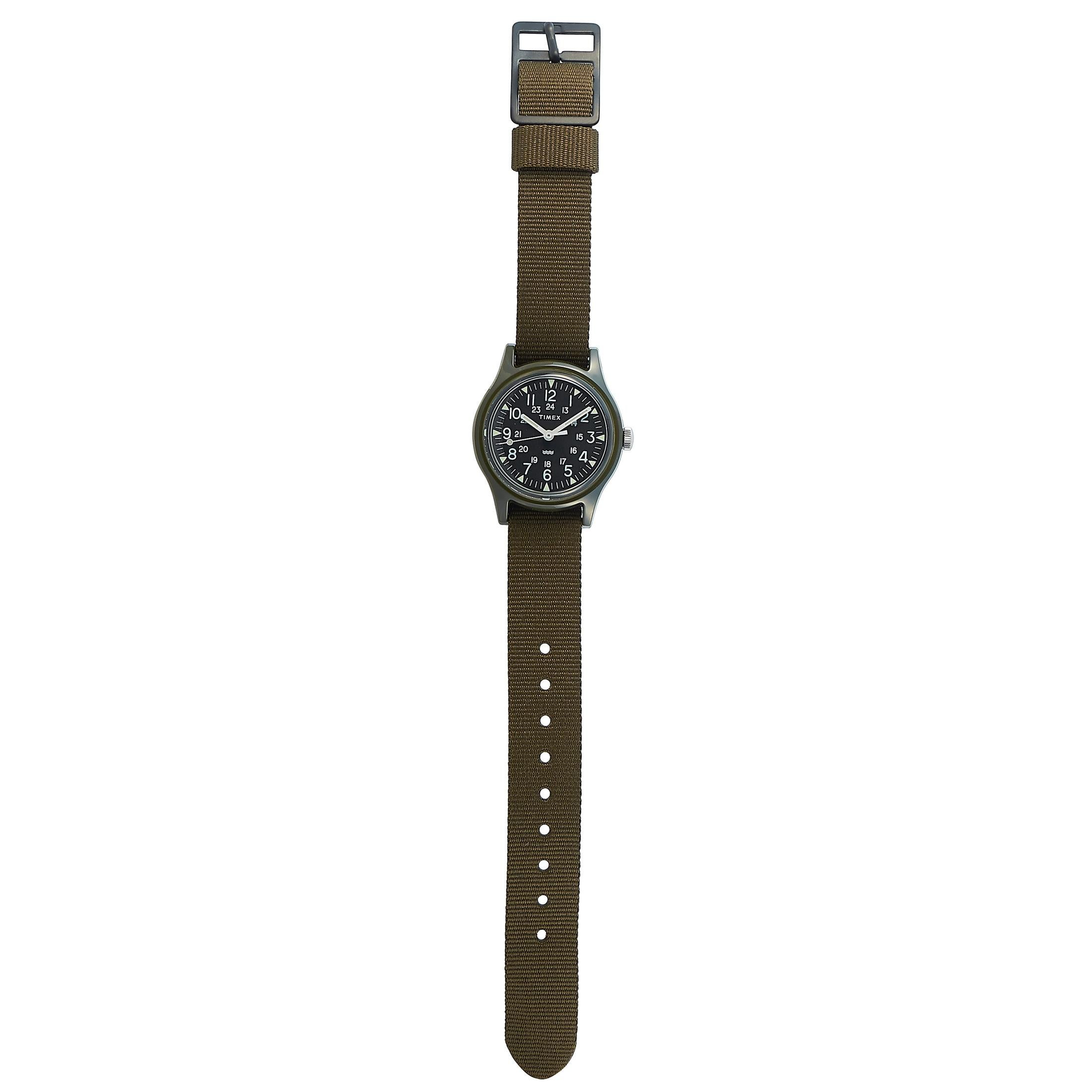 The Timex Camper Japan Limited Edition watch, reference number TW2T33700, is presented with a water-resistant resin case that measures 29 mm in diameter. The case is mounted onto an olive green fabric strap fitted with a tang buckle. The watch is