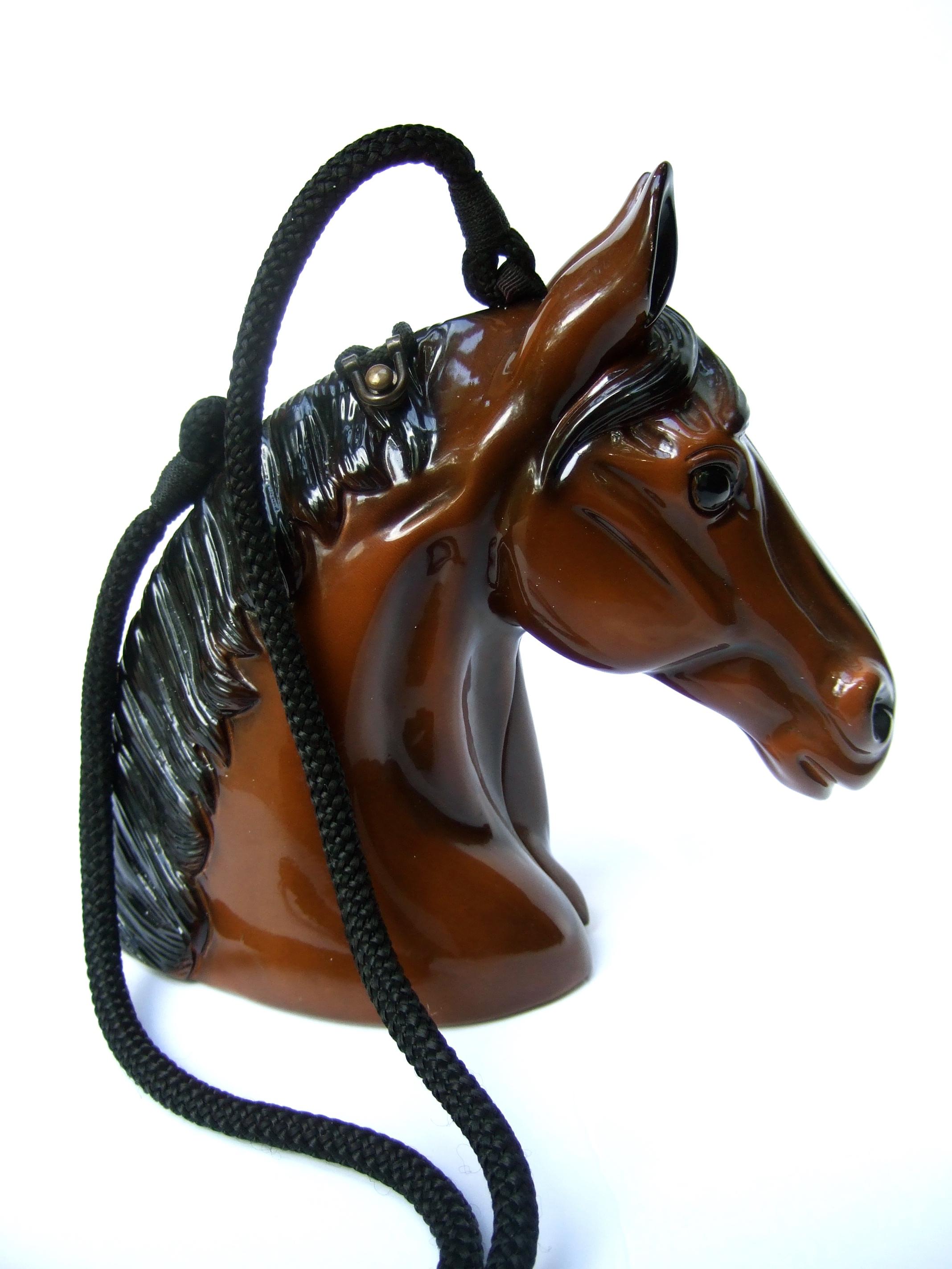 Timmy Woods Beverly Hills hand carved wood equine artisan shoulder bag c 1990s
The unique wood horse head is sheathed in glossy brown enamel lacquer 
The mane is distinguished with black enamel with a white enamel streak 
running down the horses'
