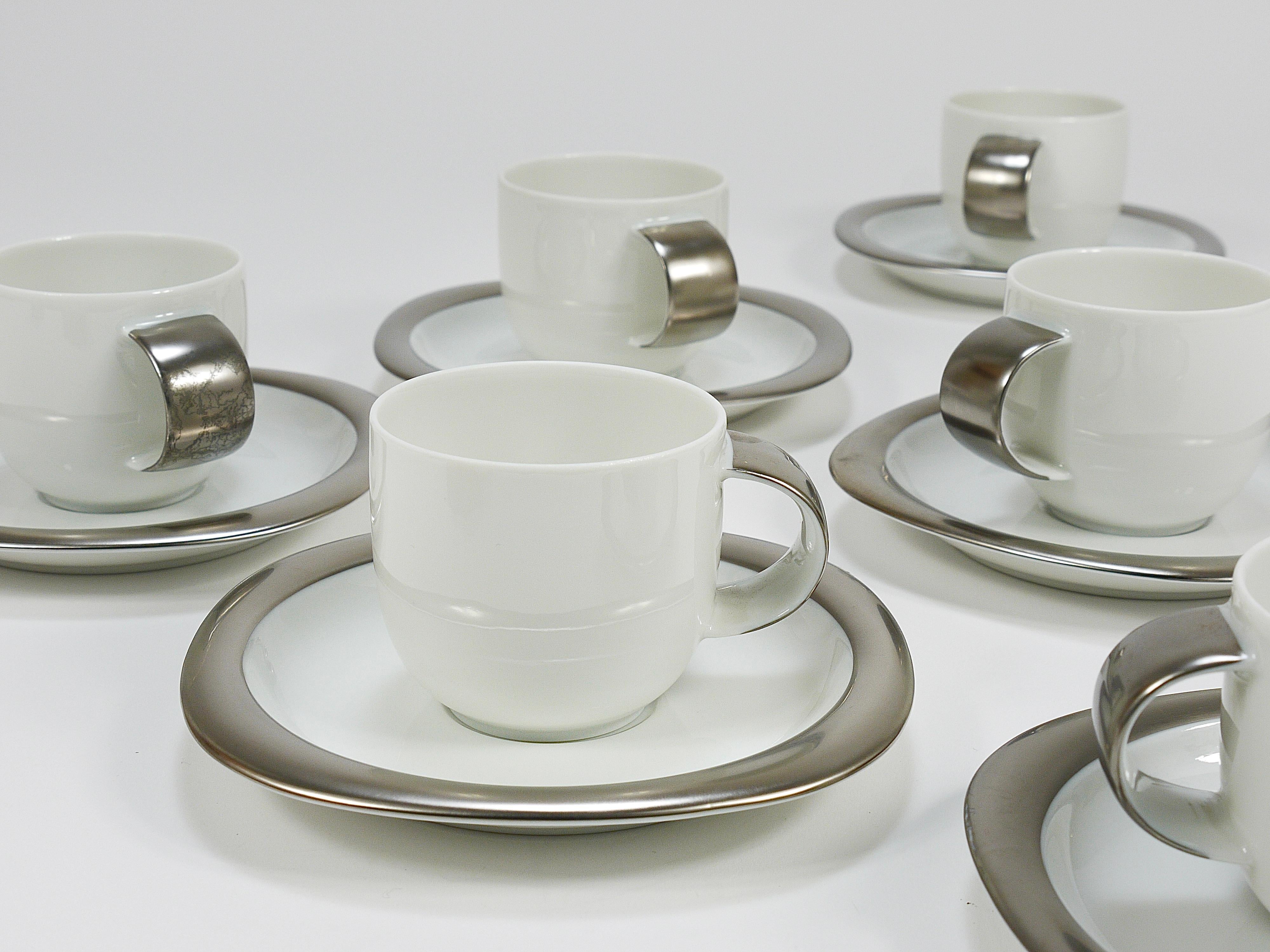 A postmodern “Suomi” espresso mocha coffee set, from the late 1980s / early 1990s. Designed by Finnish designer Timo Sarpaneva and produced by Rosenthal Studio Line, Germany. Made of fine white porcelain, the set consists of 6 cups and saucers. The