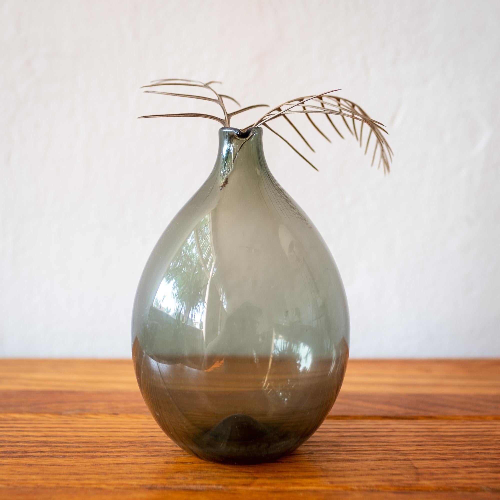Bird bottle by Timo Sarpaneva for Iittala. Hand blown gray glass. Finland. Signed and dated 1957.