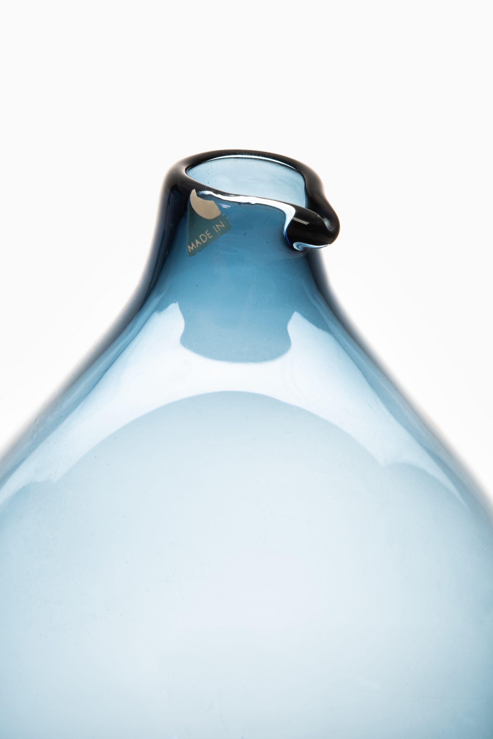 Glass bottle / vase model Pullo / Bird vase designed by Timo Sarpaneva. Produced by Iittala in Finland.