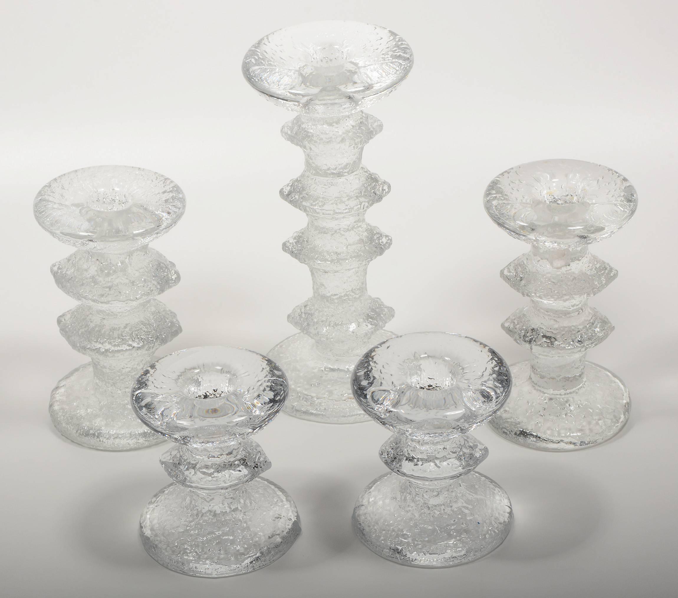 Five Festivo candle holders designed by Timo Sarpaneva for Iittala. This are 3.25, 4.75 and 7.25 inches tall.