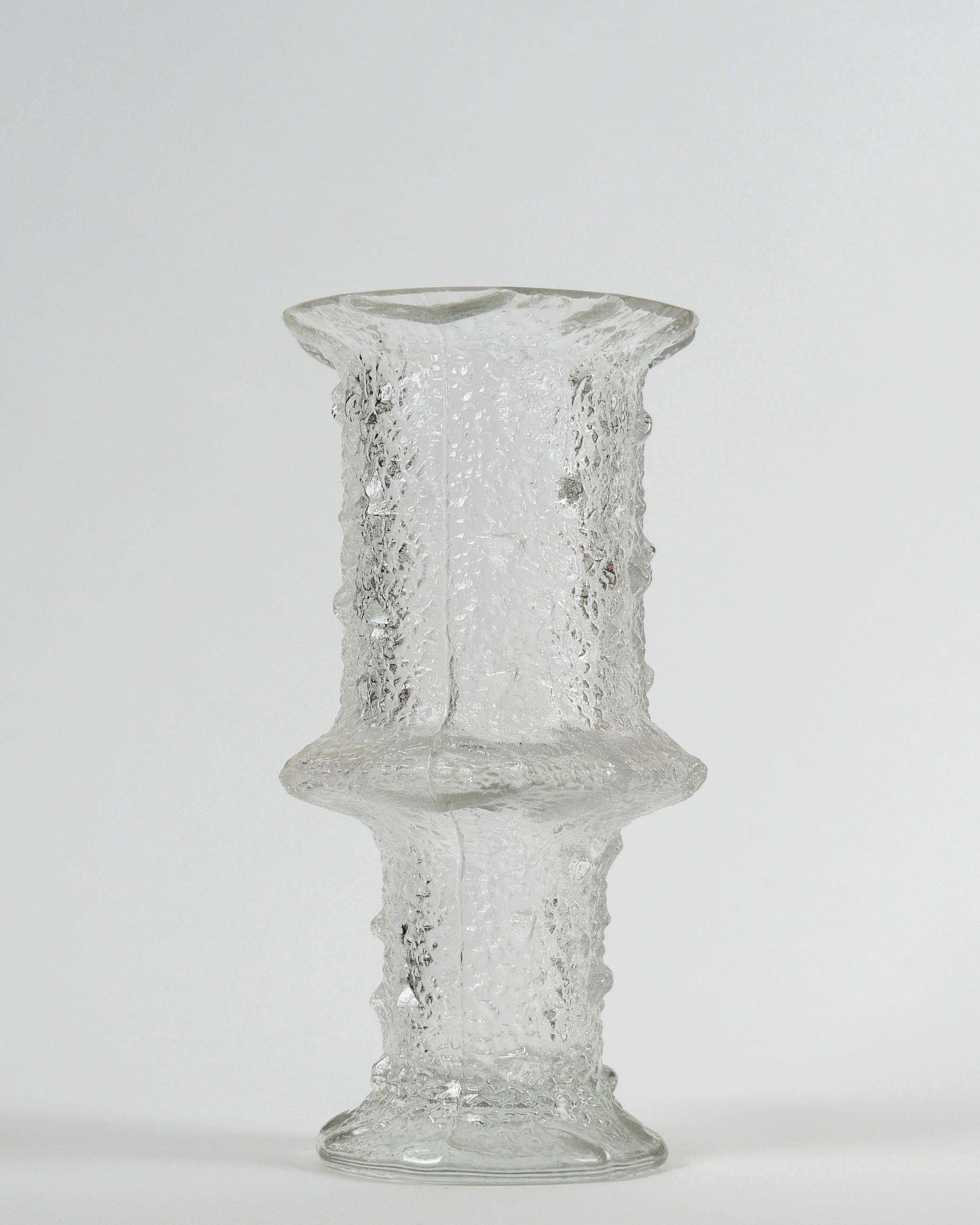 Timo Sarpaneva for Iittala, 1968
Large ‘Nardus’ Vase, model 2744, for Iittala

Clear textured mould-blown glass
Excellent condition

Dimensions approx.: diameter 13.5 cm; height 26 cm; weight: 1900 g
Shipping info: 35x25x25, 2.2kg.
