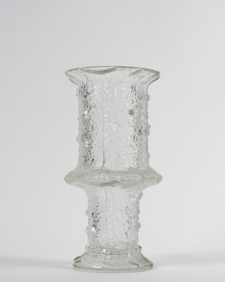 Timo Sarpaneva for Iittala, 1968
Large ‘Nardus’ Vase, model 2744, for Iittala

Clear textured mould-blown glass
Excellent condition

Dimensions approx.: diameter 13.5 cm; height 26 cm; weight: 1900 g
Shipping info: 35x25x25, 2.2kg.