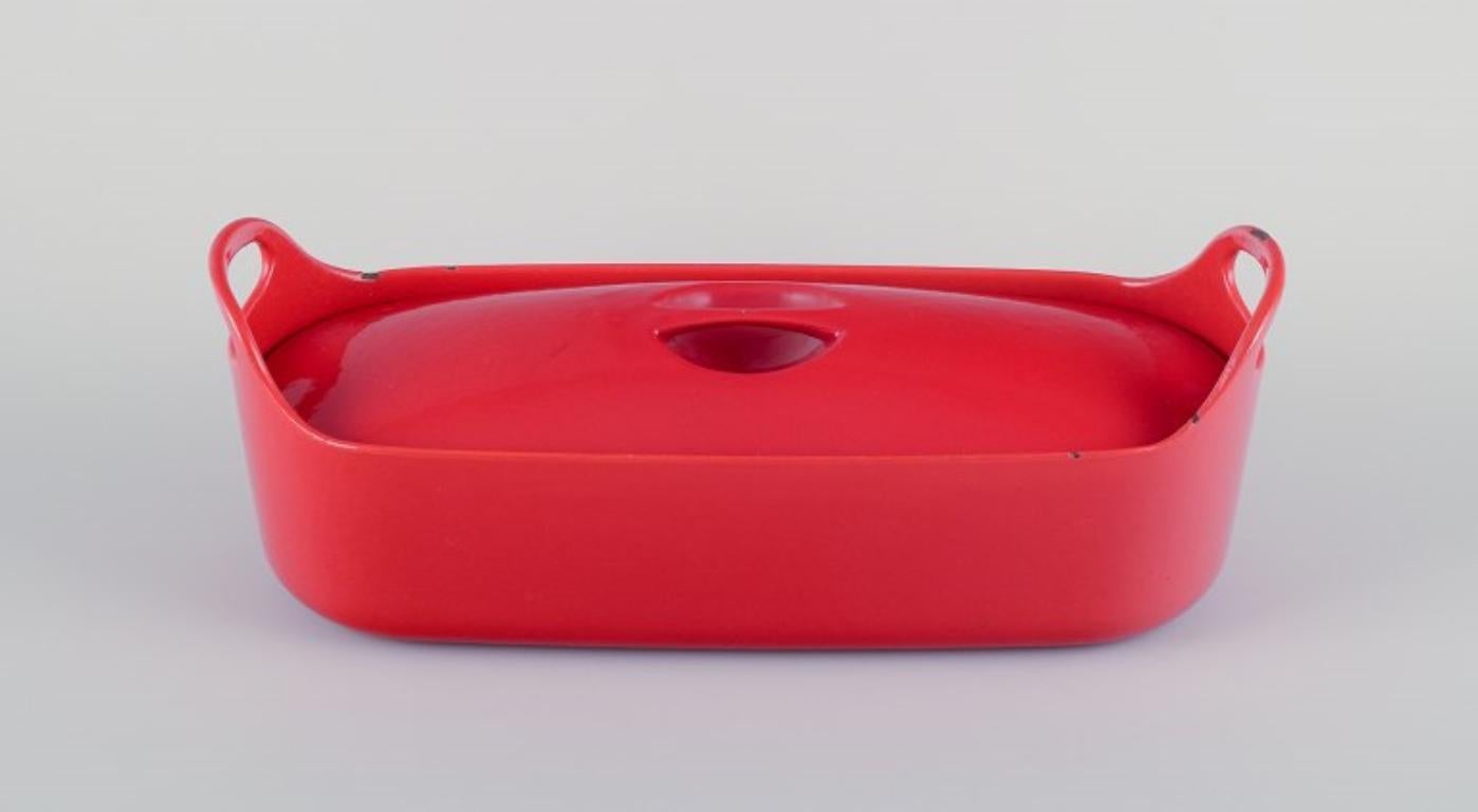 Timo Sarpaneva for Rosenlew, Finland. 
Rare fish terrine in cast iron with red enamel.
In good condition with signs of use, including some enamel chips on the lid edges.
Marked.
Measurements: L 38.0 cm x W 12.5 cm x H 13.5 cm.