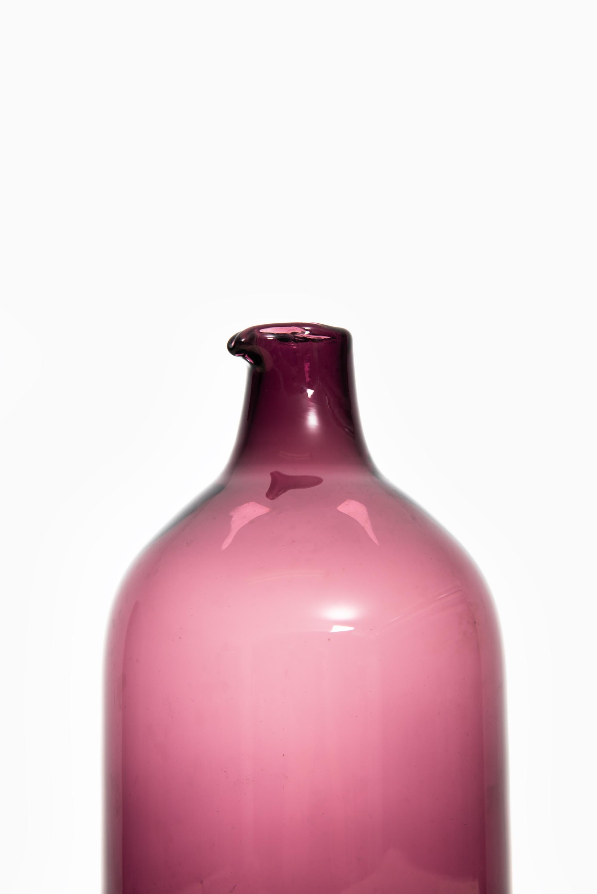 Glass bottle or vase model Pullo or Bird vase designed by Timo Sarpaneva. Produced by Iittala in Finland.