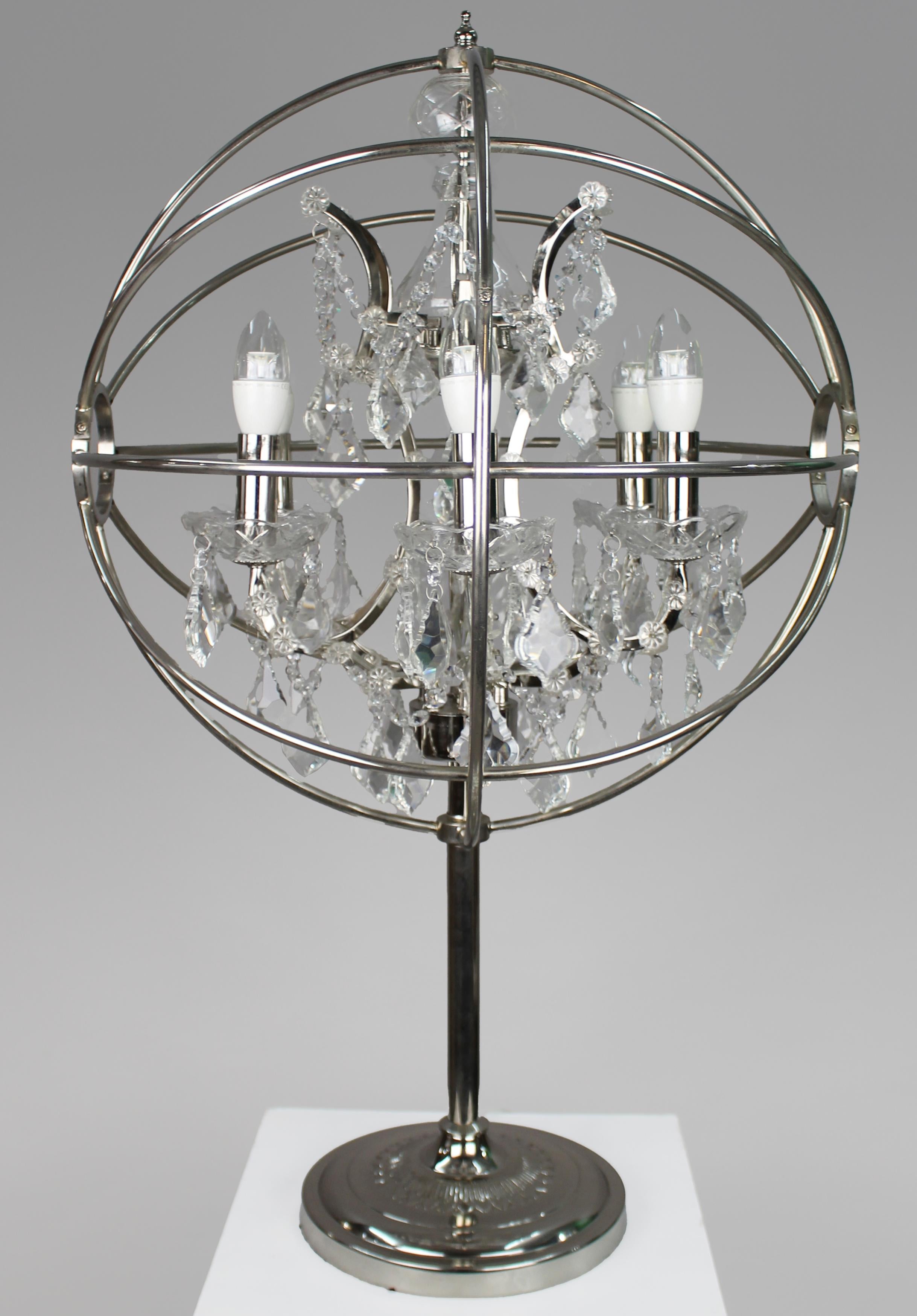 Timothy Oulton ‘Gyro Crystal’ Table Lamp
United Kingdom · Contemporary Design · Late 20th / Early 21st Century

A striking and highly decorative designer table lamp by Timothy Oulton.

The piece features a polished chrome globe frame in an armillary