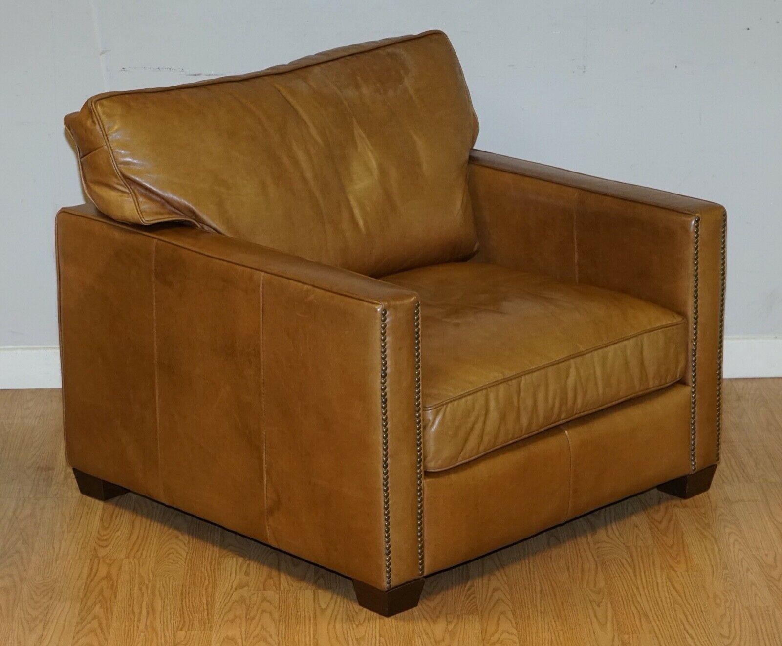We are delighted to offer for sale this lovely Timothy Oulton Halo Armchair in Brown Leather.

This is a very comfortable and solid armchair, we have the matching sofa available under our items.

There is a small mark on the top right corner of
