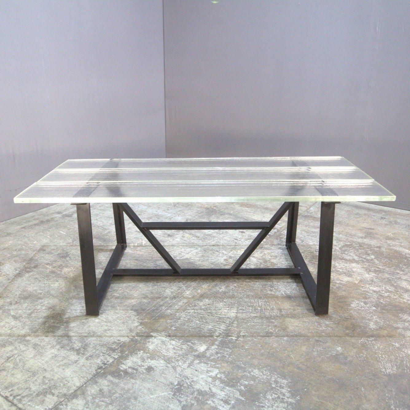 This Iceberg dining table by Timothy Oulton, crafted in 2018, combines modern design with practicality. The wood and metal construction provides a sleek and durable piece. Perfect for contemporary dining spaces. 

*Please Note that items shown