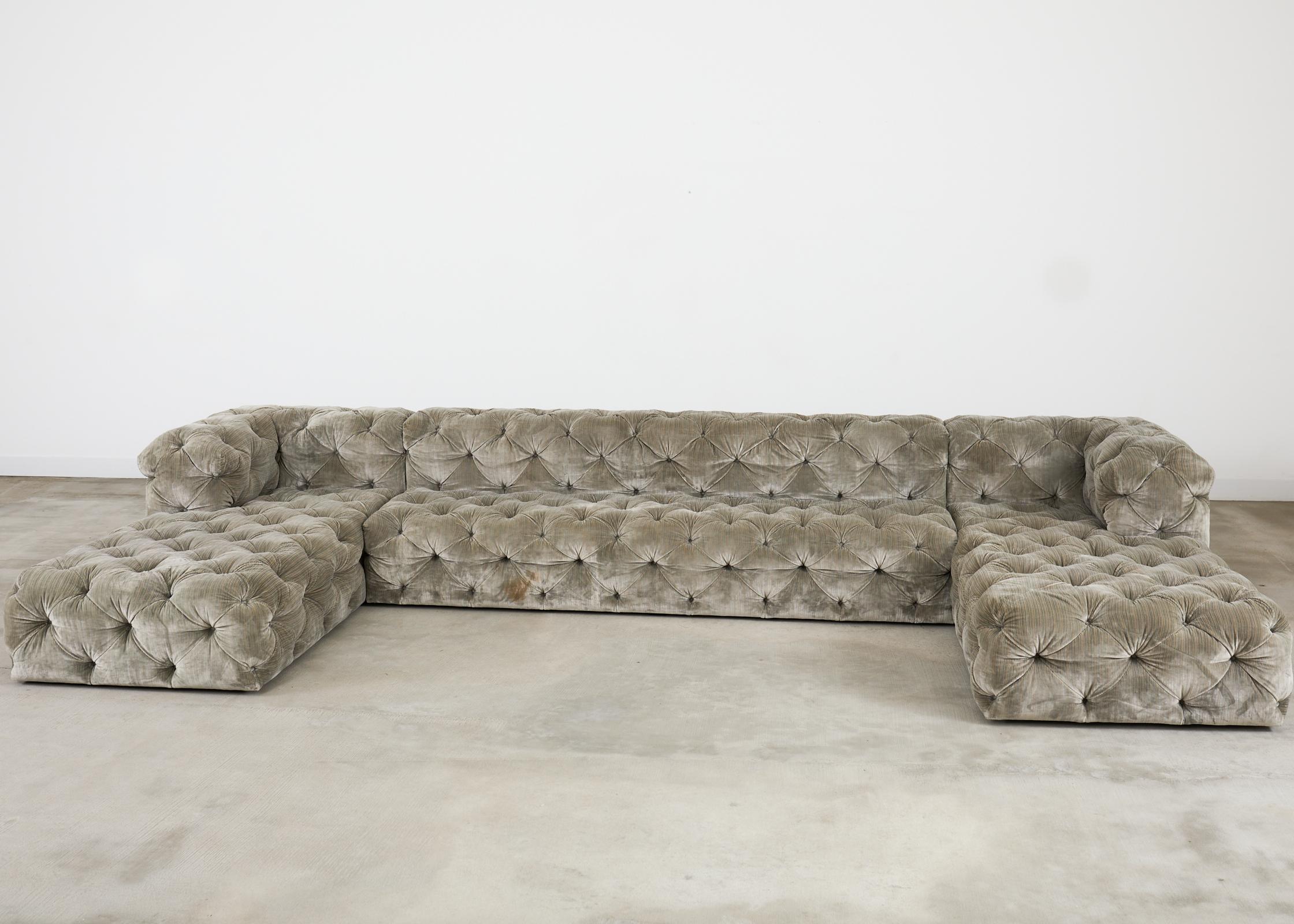 Grand three piece U-shaped sectional chaise lounge sofa designed by Timothy Oulton for Restoration Hardware measuring over 16 feet long. The Soho sofa features all-over button tufting in an English chesterfield style with a dramatic low profile.