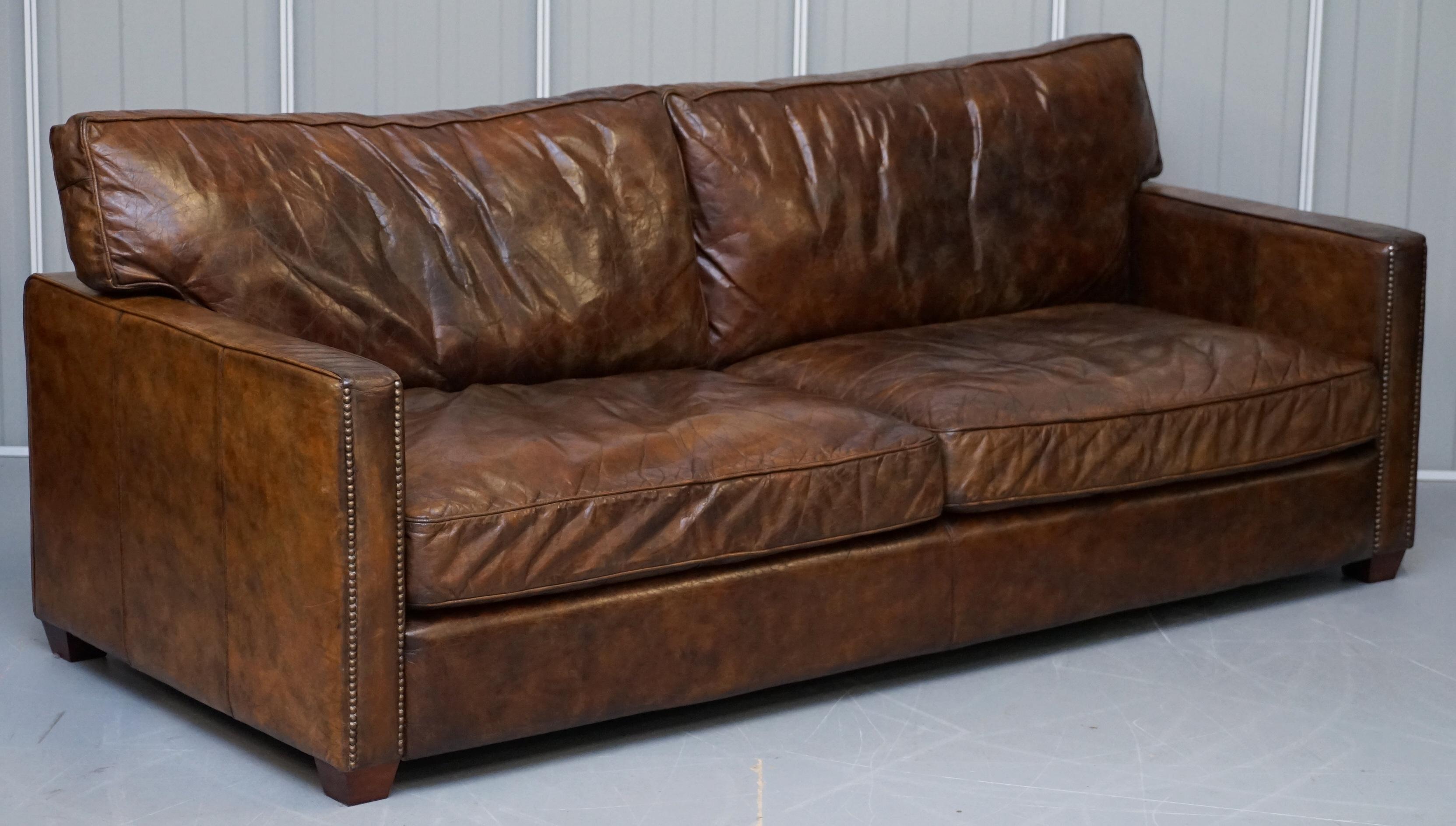 We are delighted to offer for sale this stunning original Timothy Oulton RRP £3975 Viscount William aged brown leather sofa

This sofa is in good used condition throughout, it has a lovely vintage heritage leather which is distressed and aged from