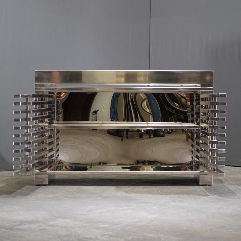 Timothy Oulton Zazenne Sideboard: This sideboard by Timothy Oulton, crafted in 2018, combines modern design with practical storage. The wood and metal construction provides a sleek and durable piece. Perfect for contemporary living spaces.