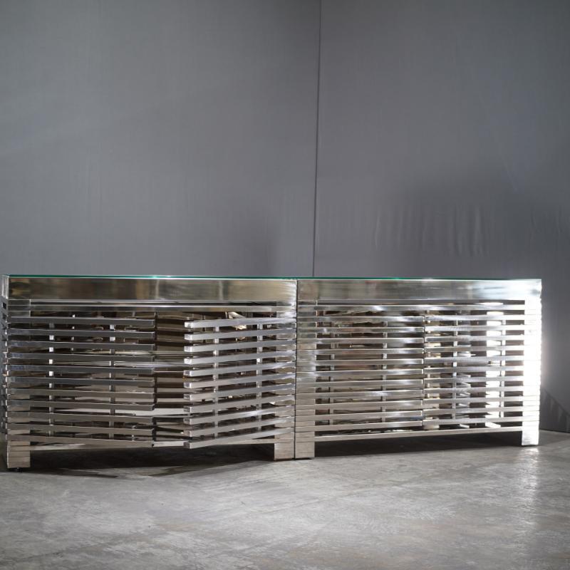 Timothy Oulton Zazenne Sideboard: This sideboard by Timothy Oulton, crafted in 2018, combines modern design with practical storage. The wood and metal construction provides a sleek and durable piece. Perfect for contemporary living spaces.